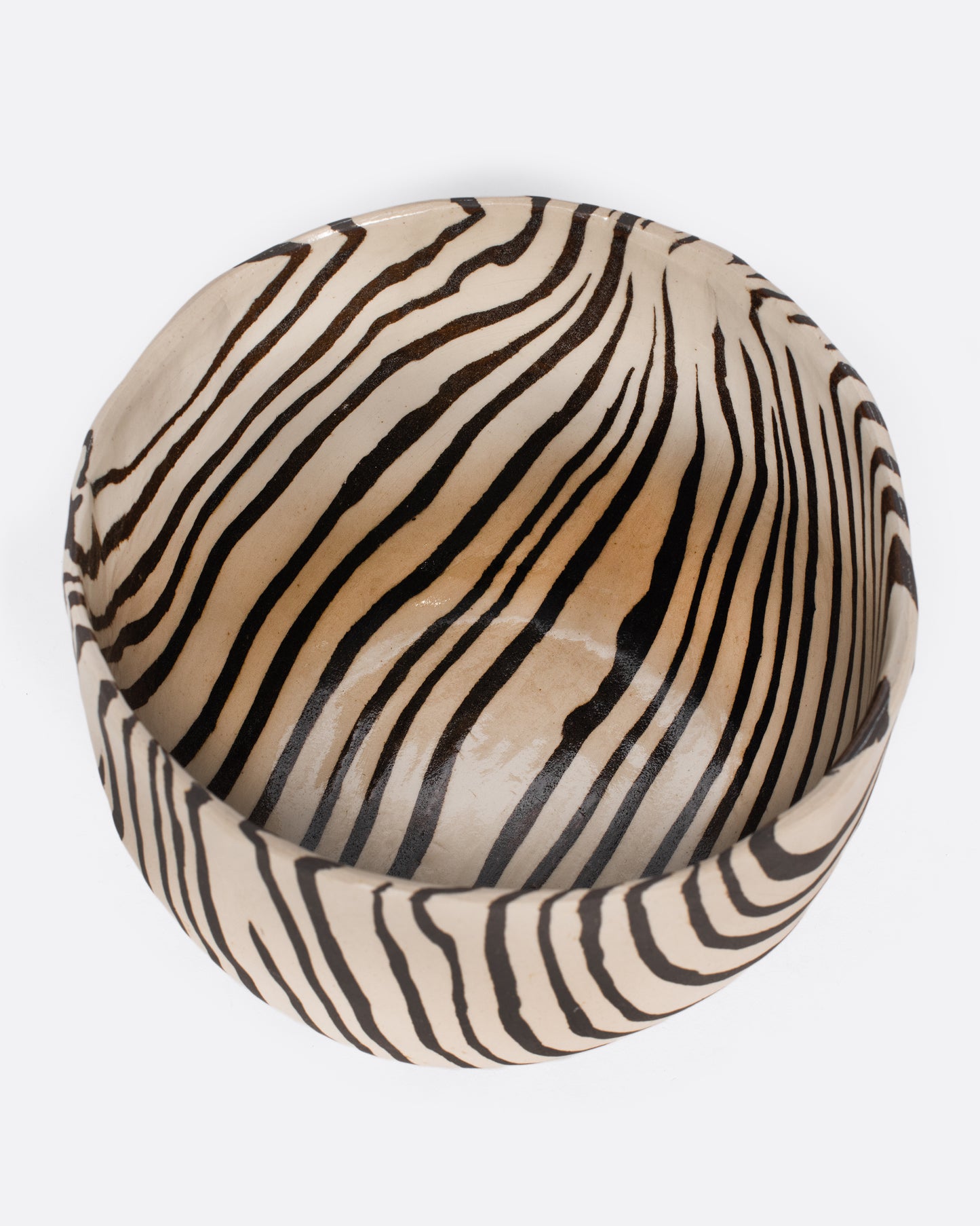 These small-batch ceramic bowls are made with a traditional Japanese Nerikomi technique that creates an intricate, marbled design by layering and compressing clay. Each bowl has a unique, zebra-striped design that feels other-worldly and timeless. Available in small, medium, and large sizes.