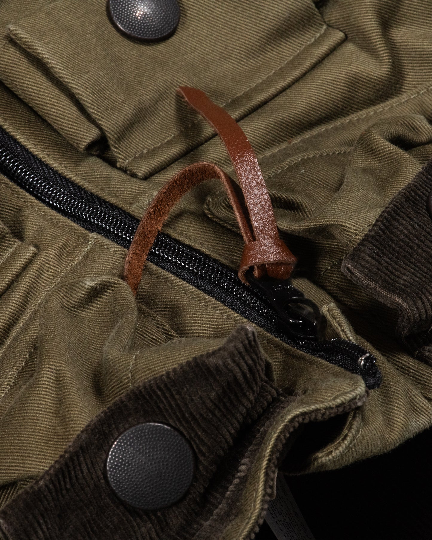 One of Kapital's beloved anoraks, made from two colors of cotton chino material with six mini pockets around the neck and a zip pocket with a flap on the front.