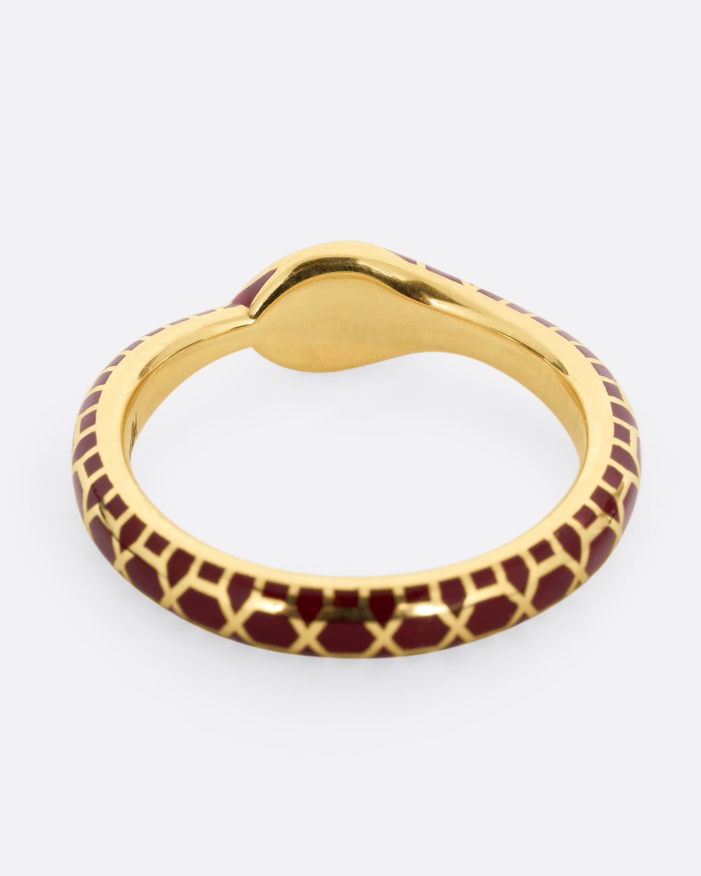 yellow gold ring with emerald and enamel shown lying flat from the back