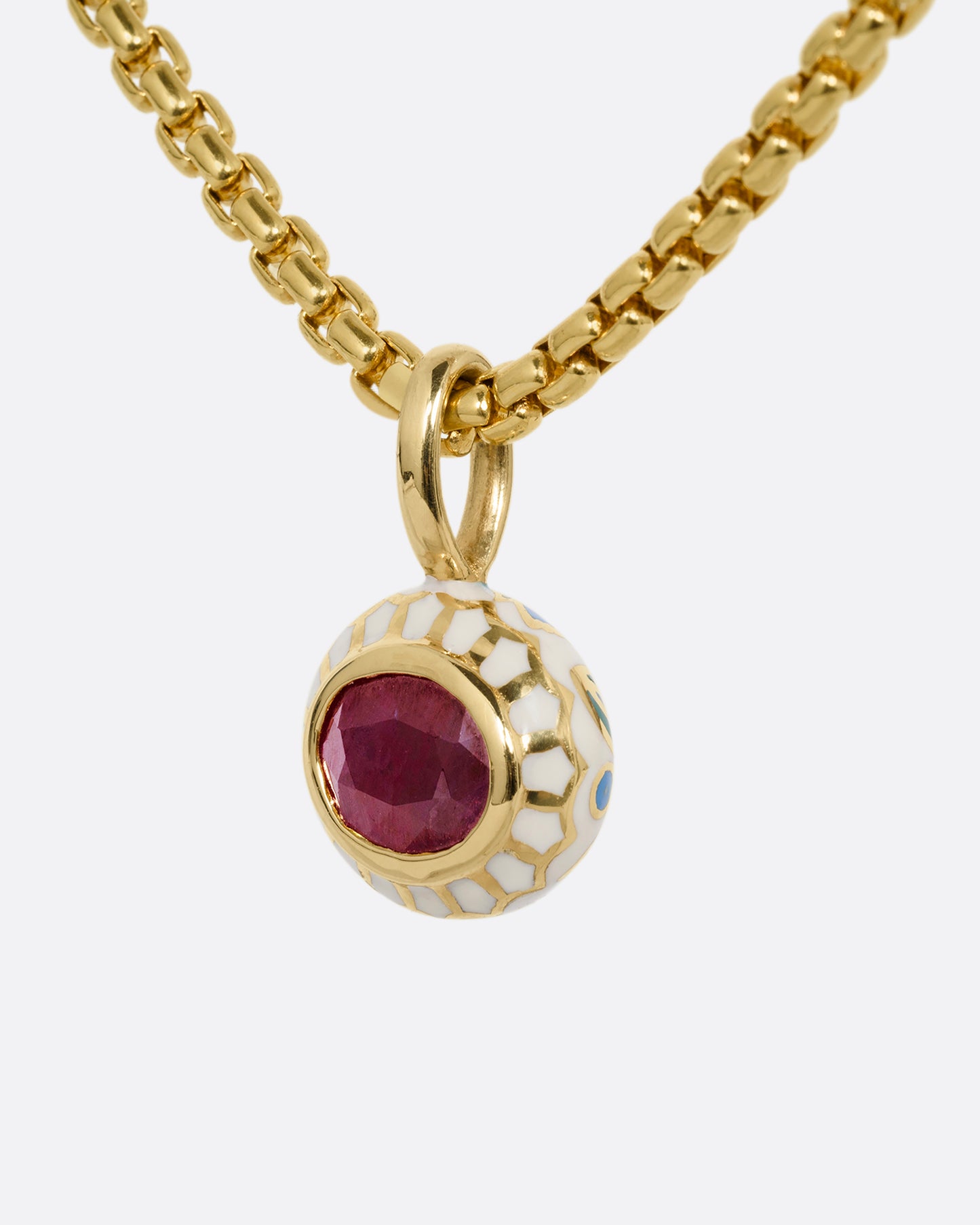 yellow gold ruby pendant with enamel shown from the side