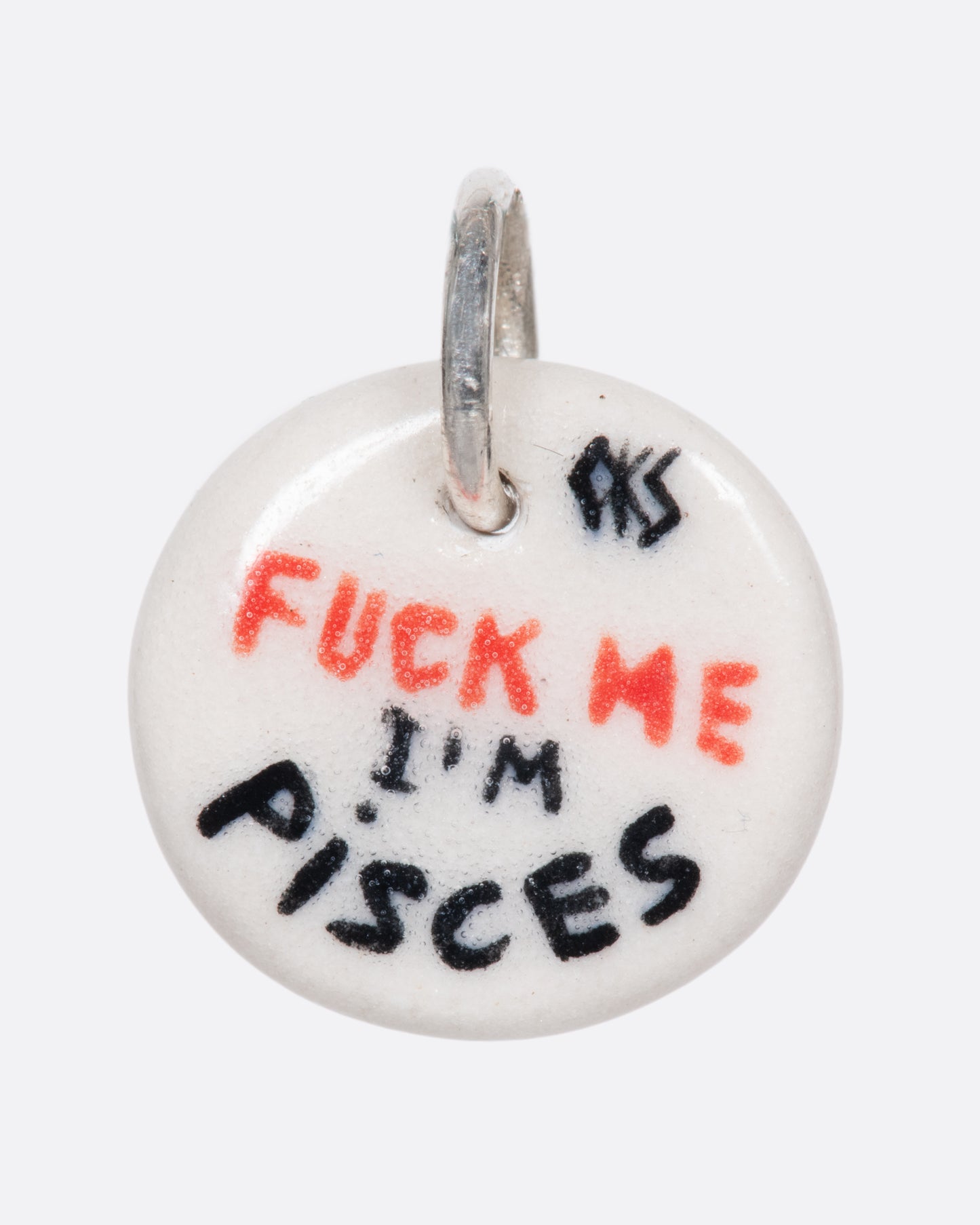A handmade and painted porcelain zodiac disc charm with a sterling silver bail, featuring a sex position specific to each zodiac.
