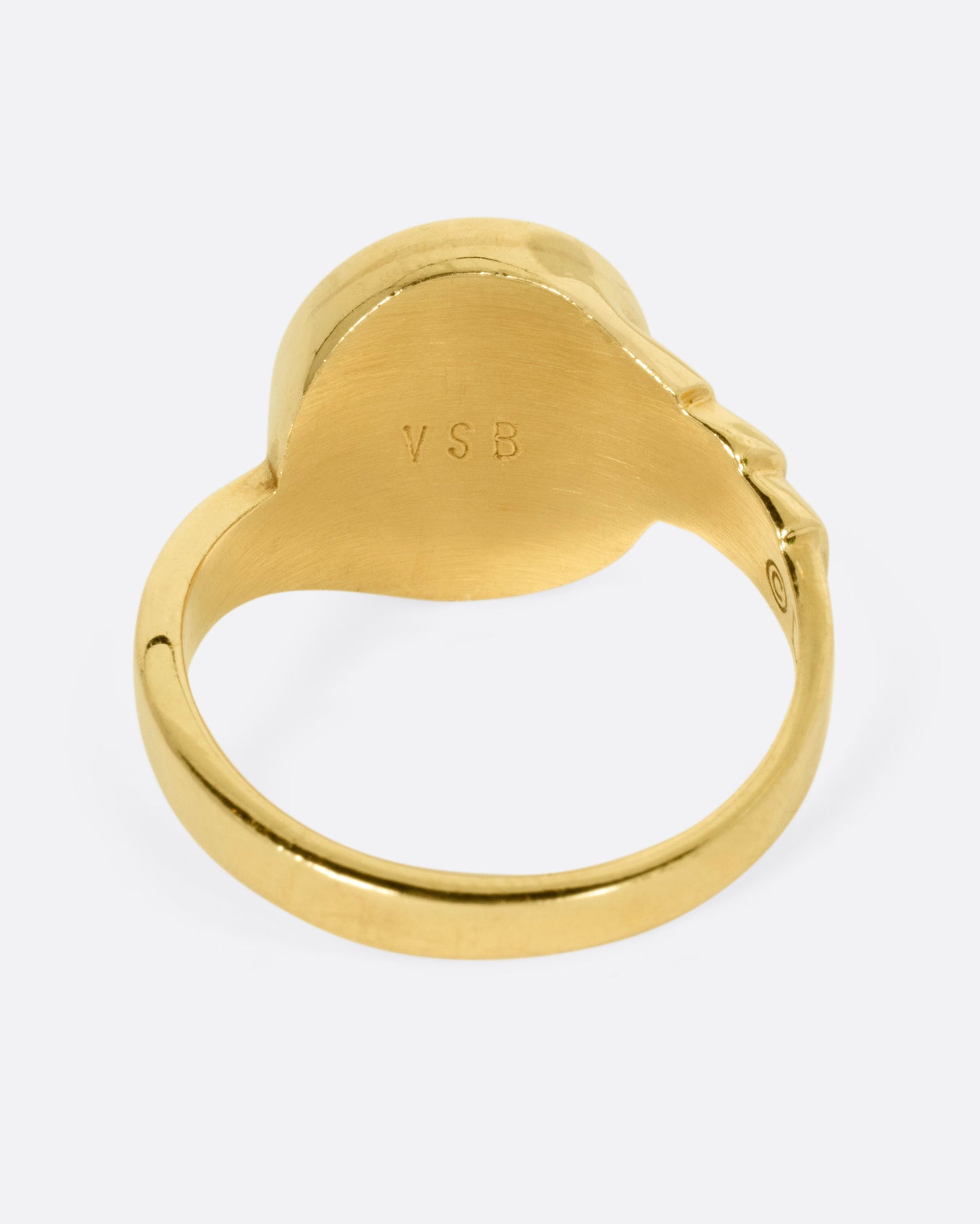 A yellow gold ring with Mickey Mouse on its face and '1973' on its shoulder, shown from the back.