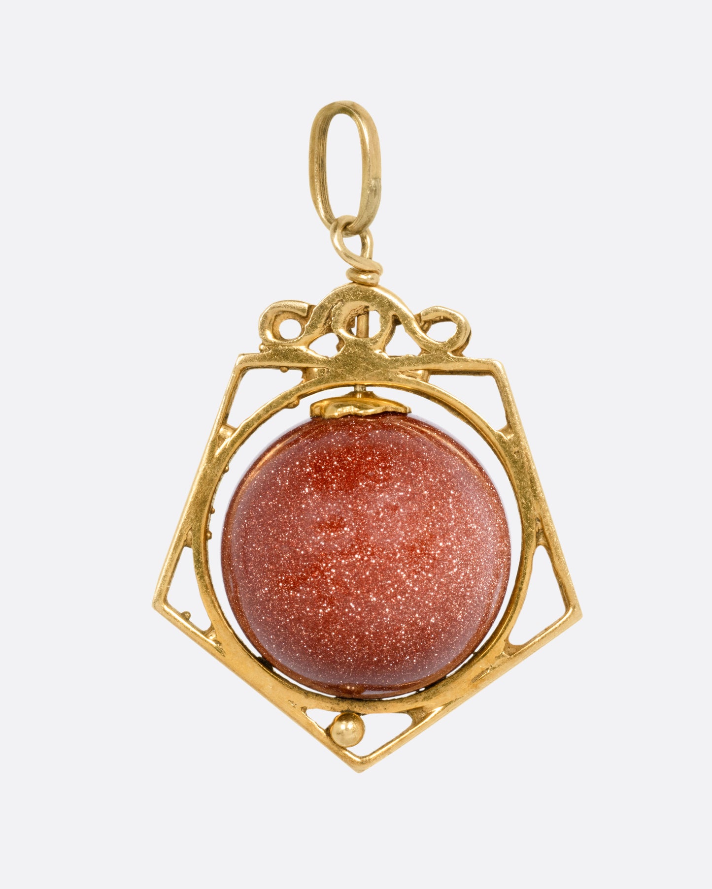 A yellow gold pendant with a spinning Italian goldstone sphere, shown from the front.