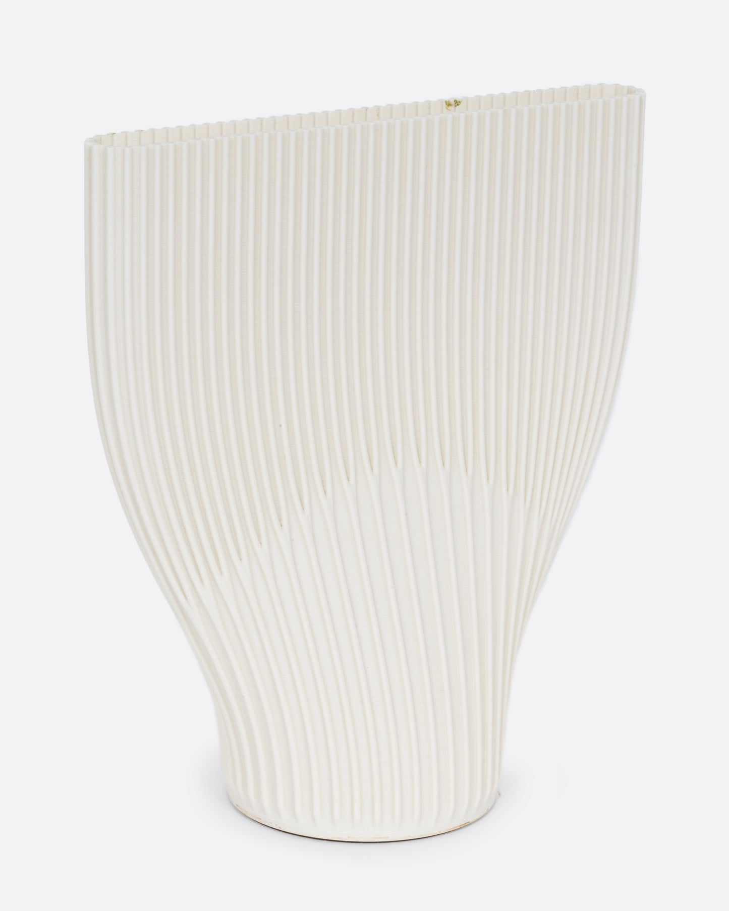 A ribbed cream 3D printed vase with a wide top and narrow base. Shown from the side.