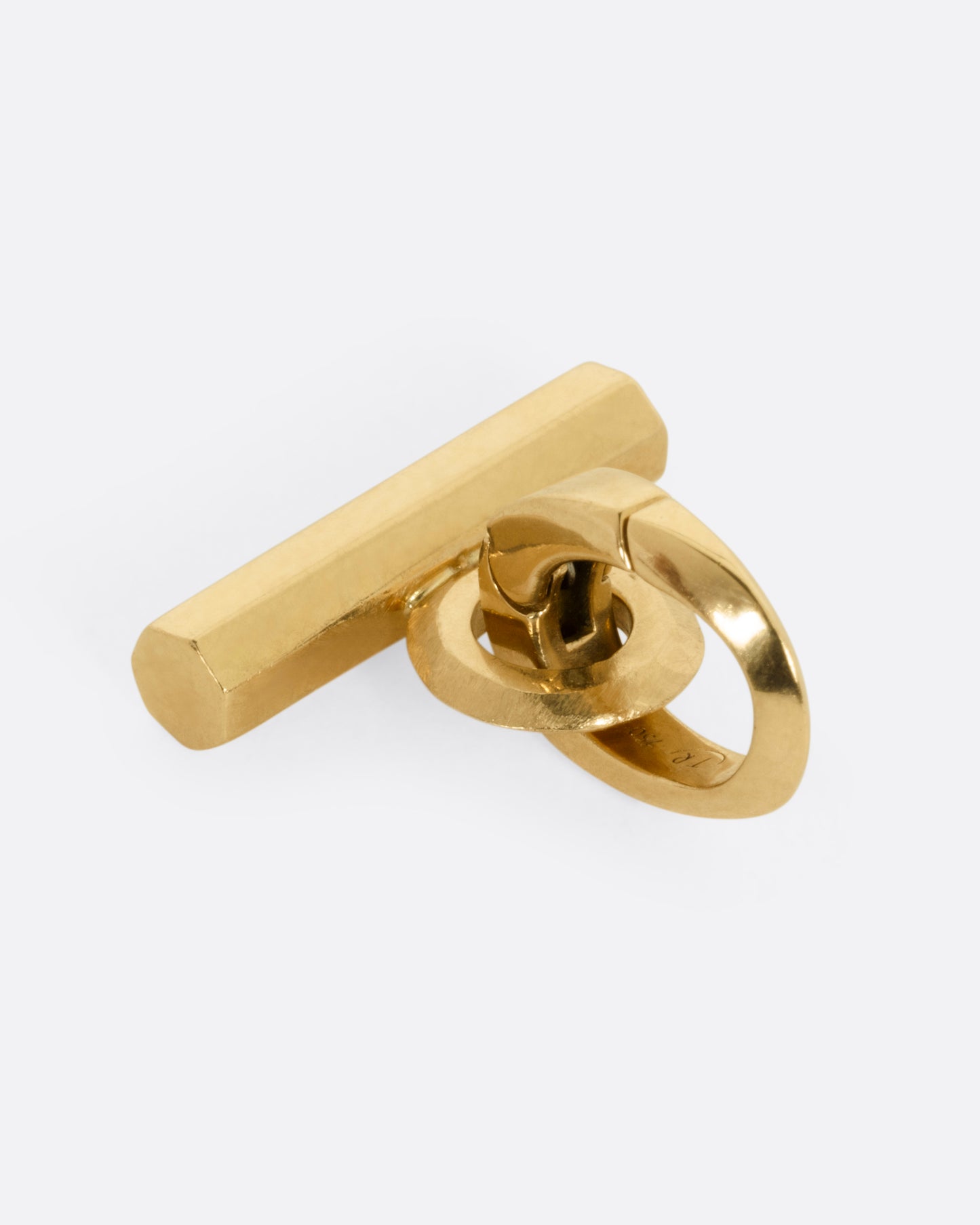 A yellow gold T-Bar charm shown from the side.