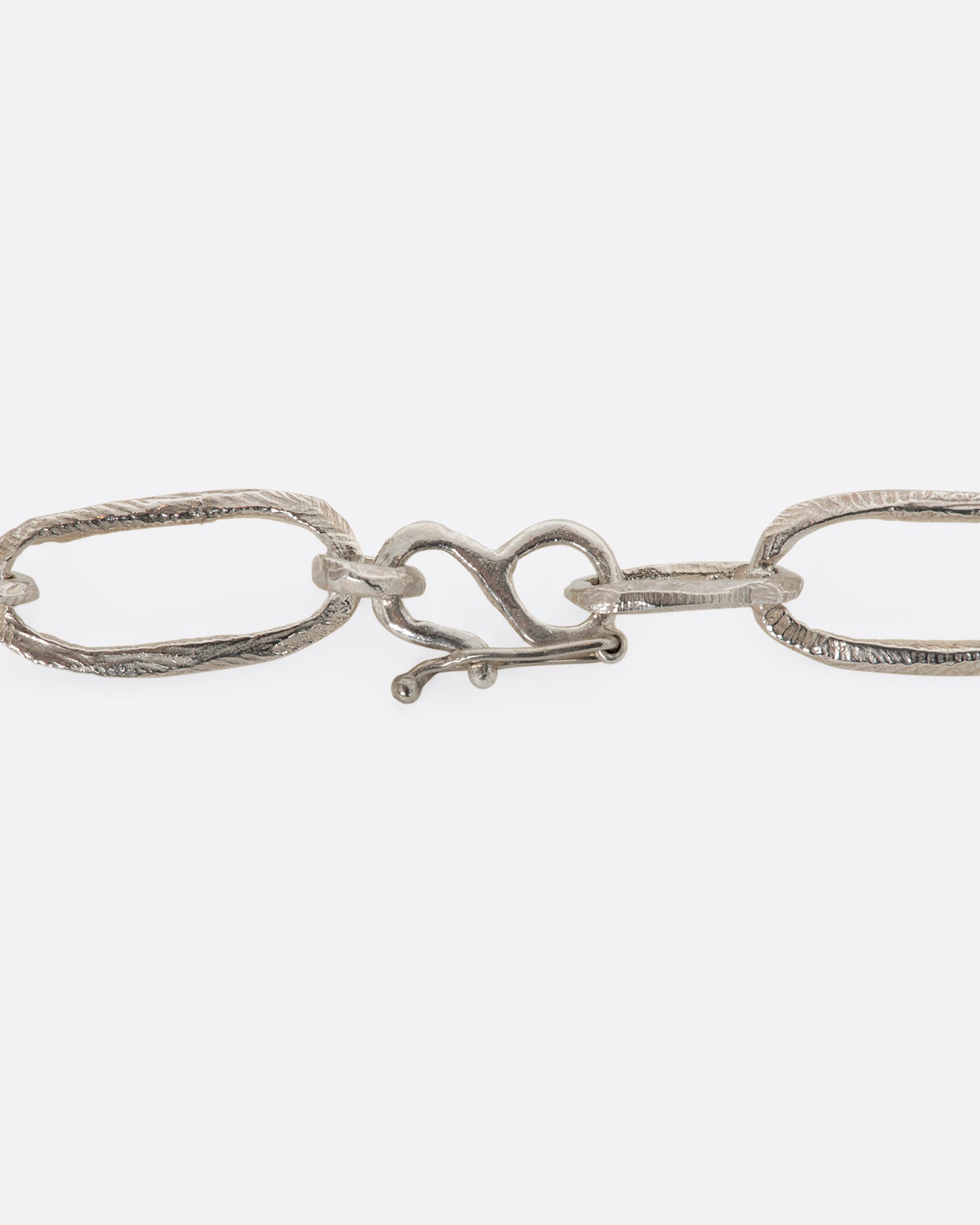 Sterling silver hand carved chain necklace. View of the closure.