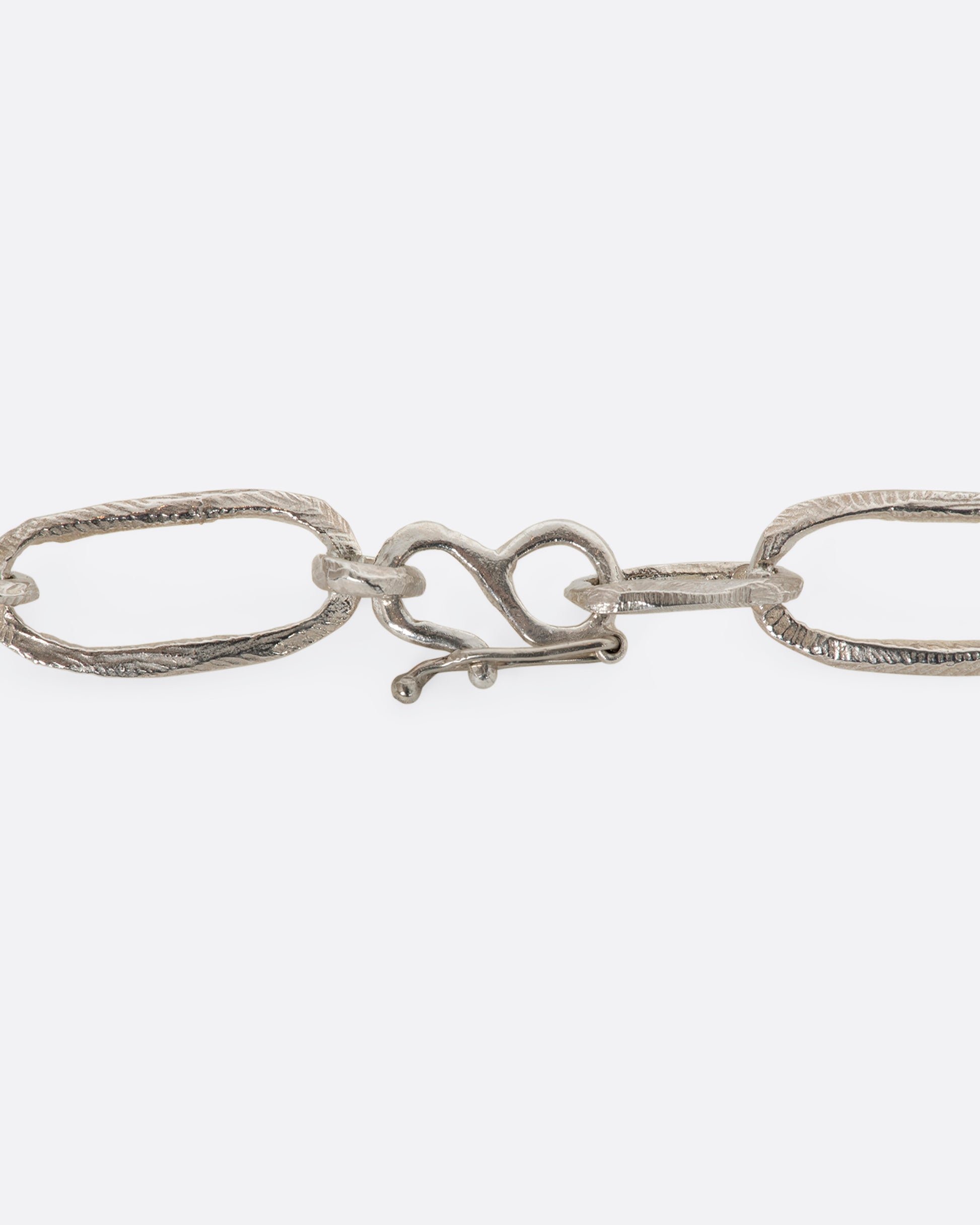 Sterling silver hand carved chain necklace. View of the closure.