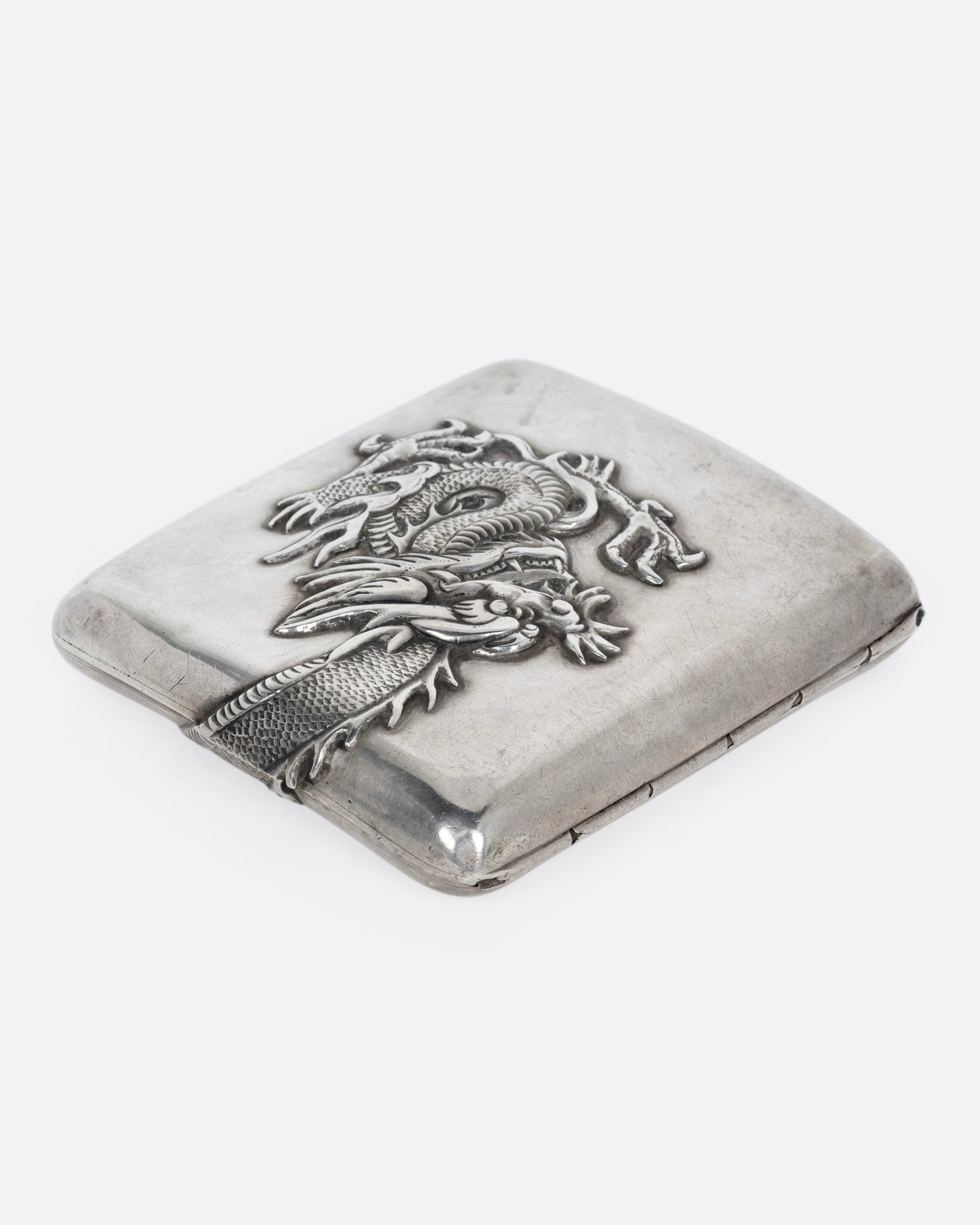 A silver box with a wagon on it, shown from the side.