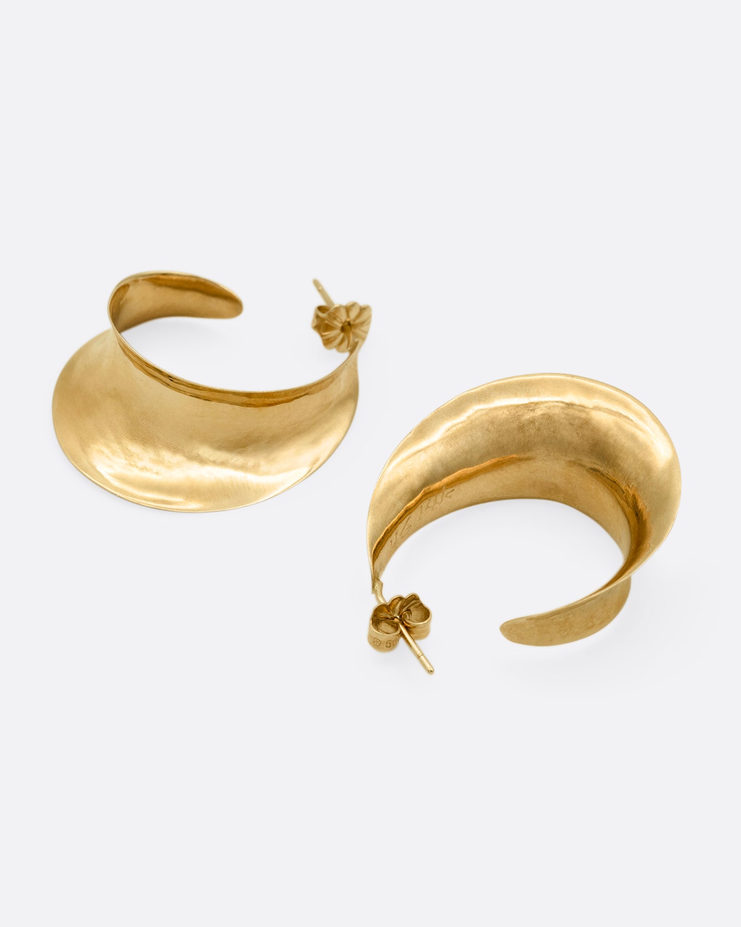 Yellow gold hoop earrings with a ribbon- like shape. One earring is shown from the front, the other from the back.