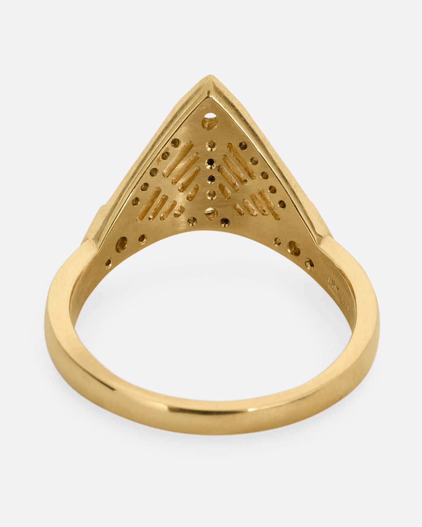 A yellow gold ring with a triangular face, white diamond accents, and cutouts. Shown from the back.