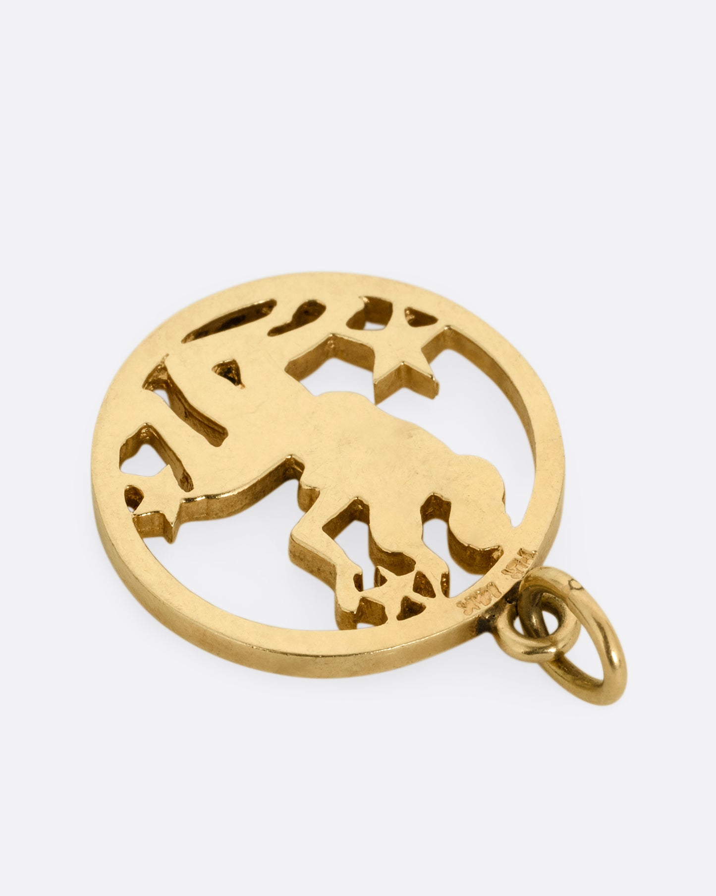 An open silhouetted pendant with the Gemini Twins at the center. Shown from the back.