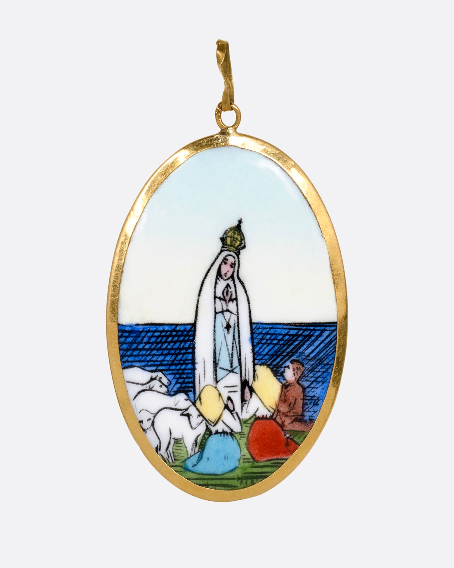 A yellow gold pendant with a hand painted image of the Virgin Mary sits at the center and "Na sa do Rosario da Patima" on its reverse. Shown from the front.