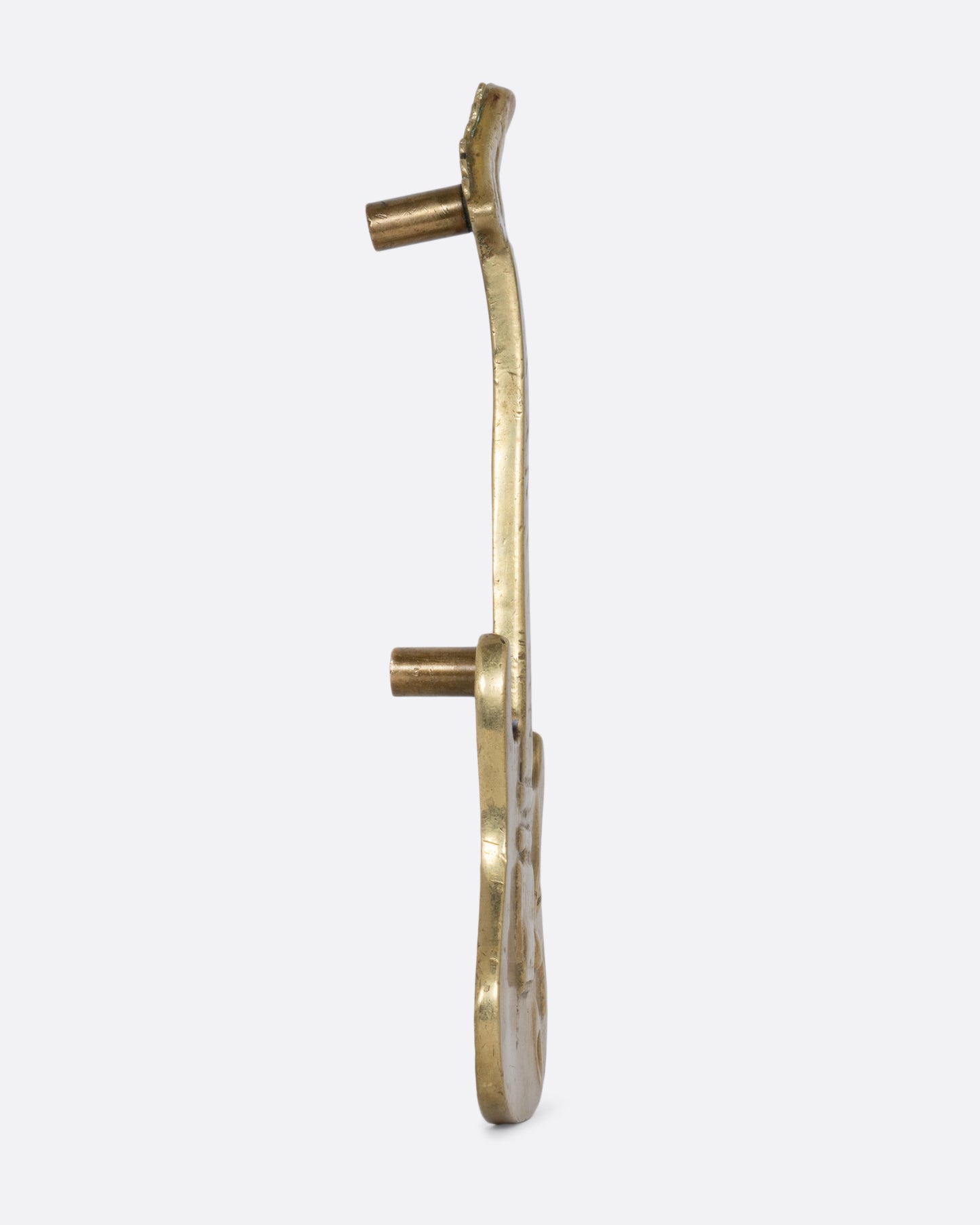 A brass electric guitar door handle shown from the side.