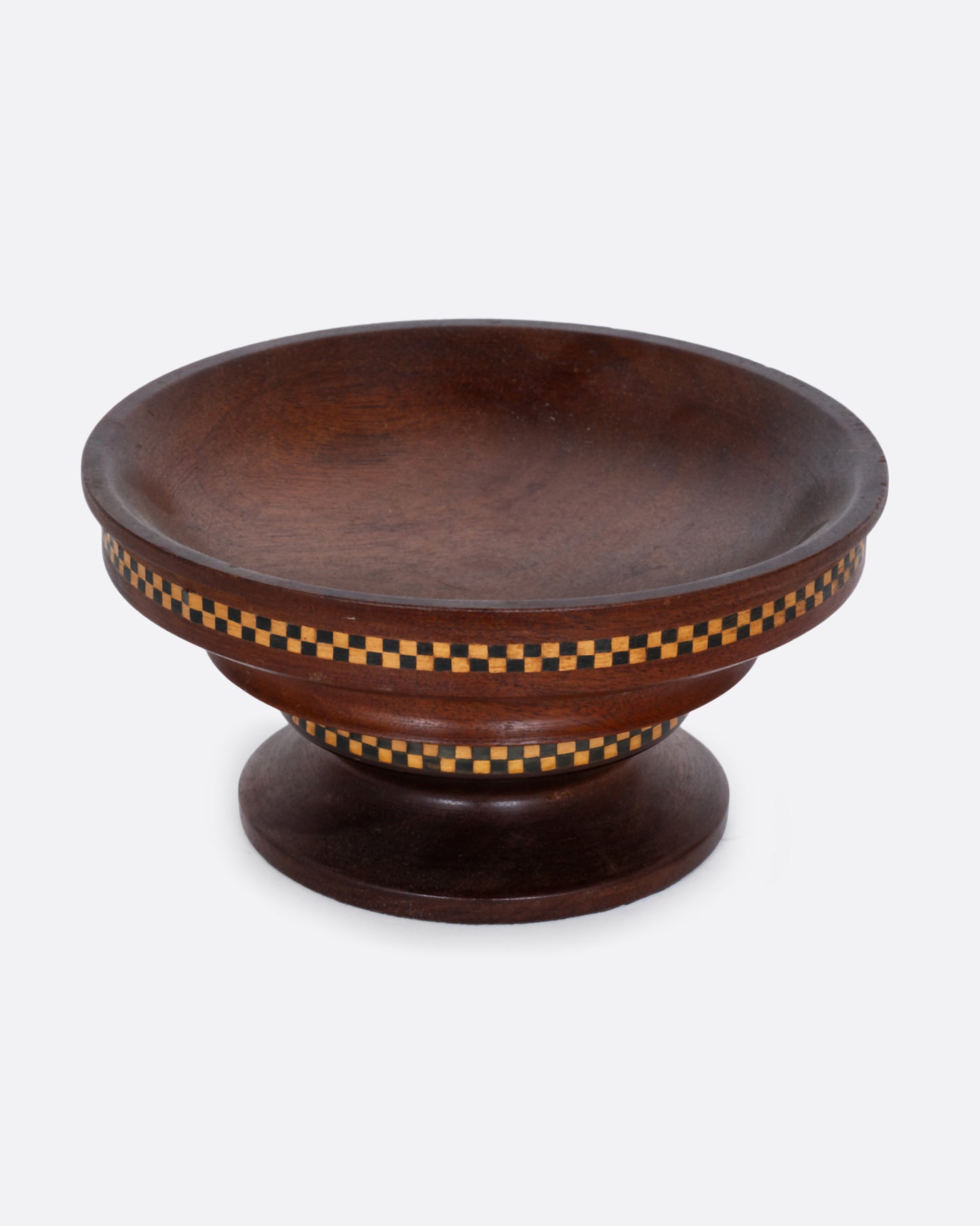 A wooden hand turned bowl with a checkerboard inlay and felted bottom. Shown as a bird's eye view from the front.