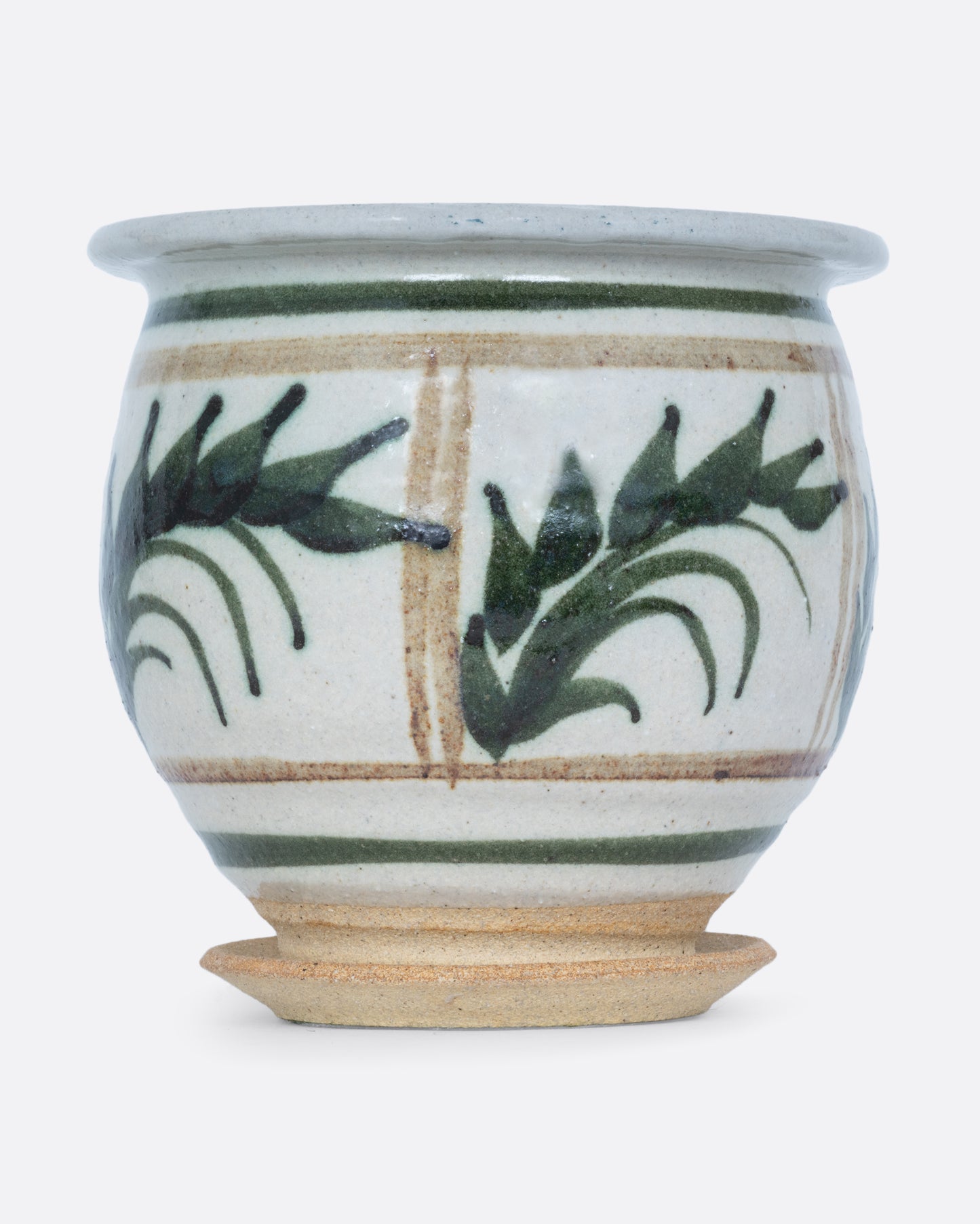 A planter with a hand painted botanical pattern and a drainage hole, water catch, and felted bottom. Shown from the front.