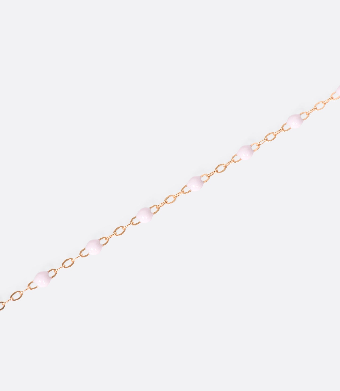 A thin rose gold chain necklace with resin beads. Each necklace is hand dipped in melted resin to create the beaded effect. 