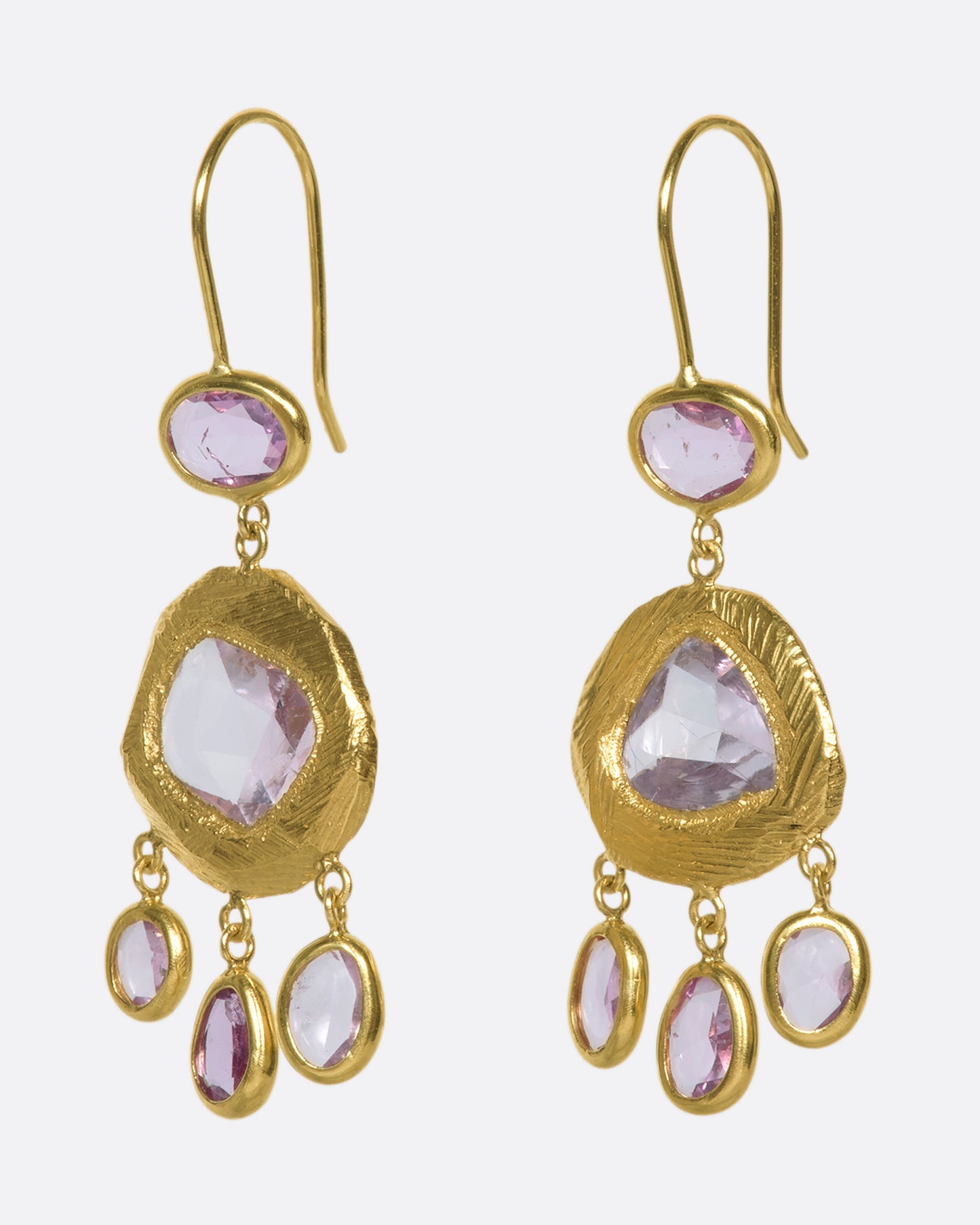 One-of-a-kind three-tiered dangle earrings with pink sapphires set in 18k gold.