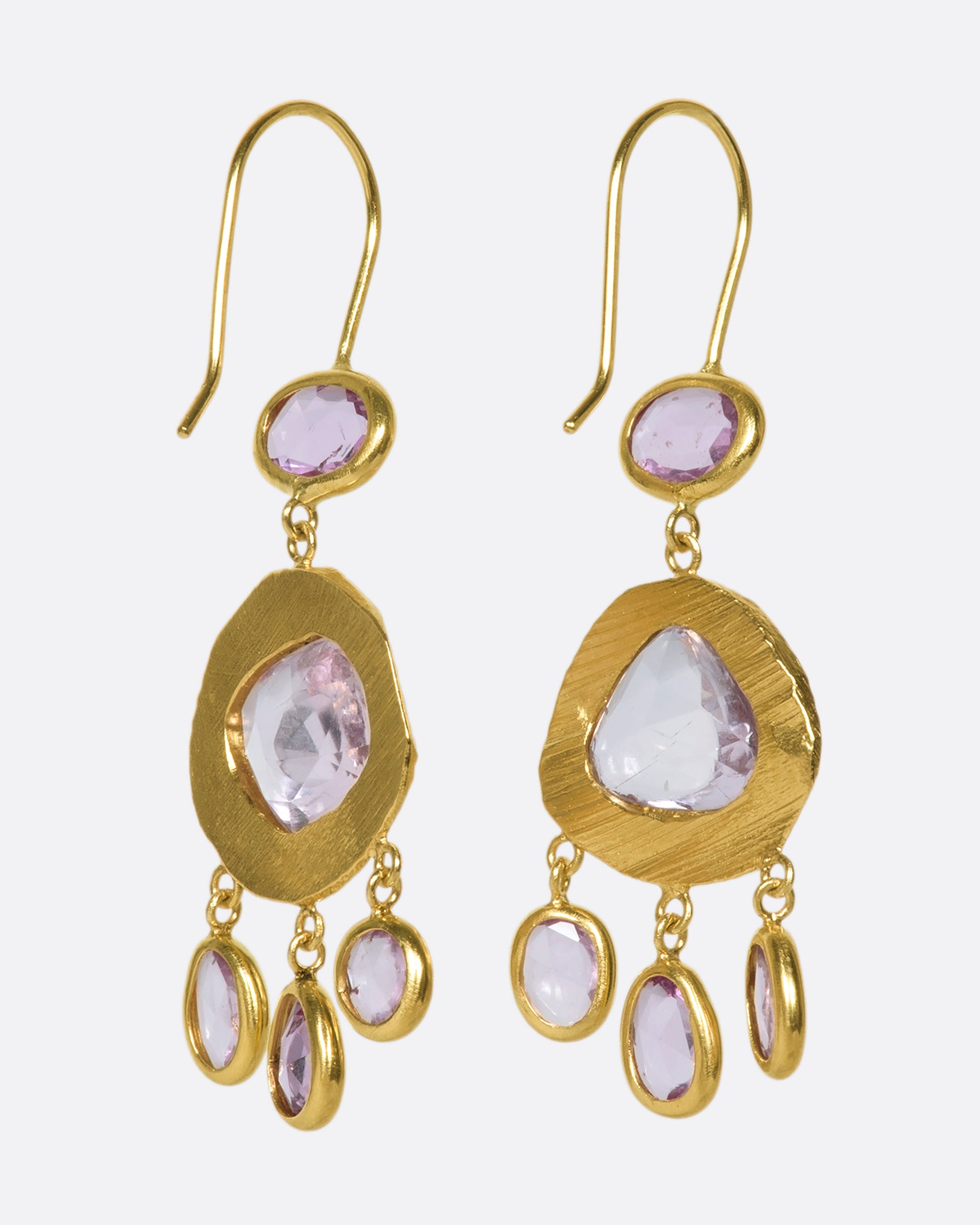 One-of-a-kind three-tiered dangle earrings with pink sapphires set in 18k gold.