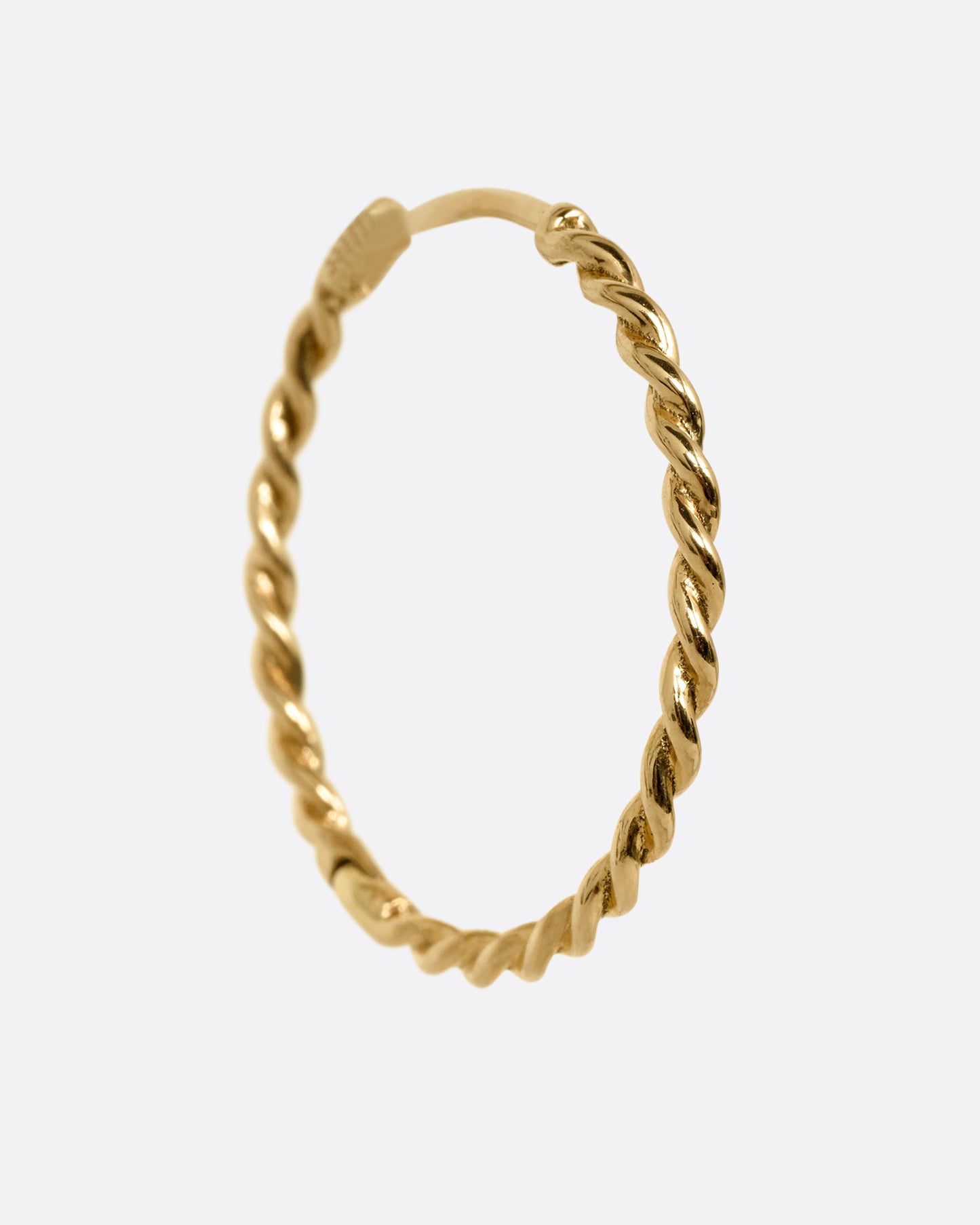 A yellow gold twisted hoop earring with a clicker clasp, shown from the side.