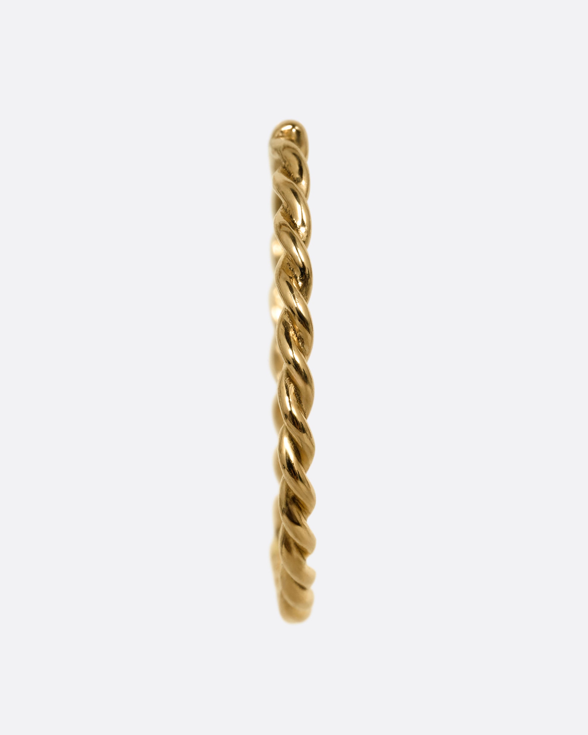 A yellow gold twisted hoop earring with a clicker clasp, shown from the front.