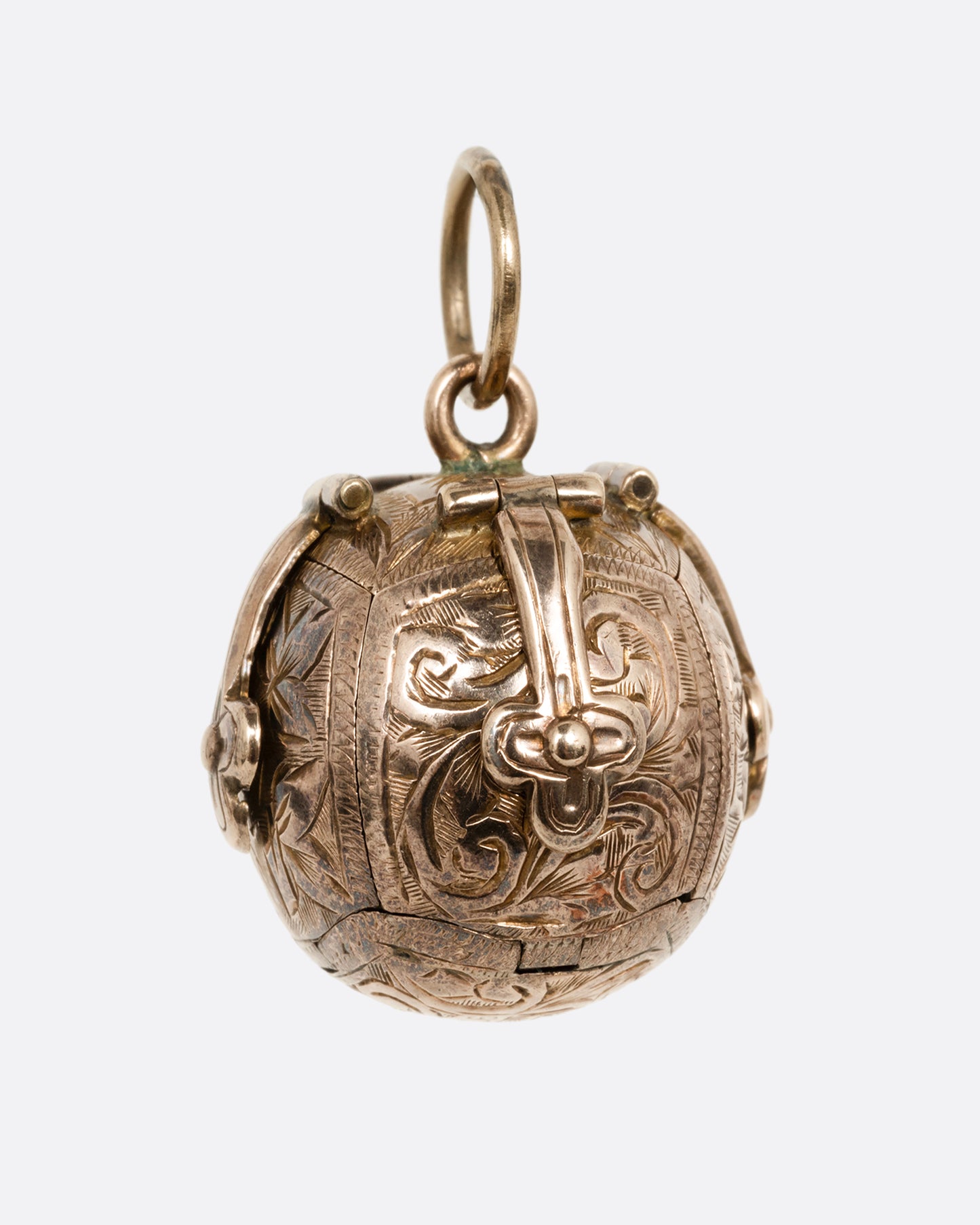 A yellow gold engraved Masonic Orb pendant shown from the front.