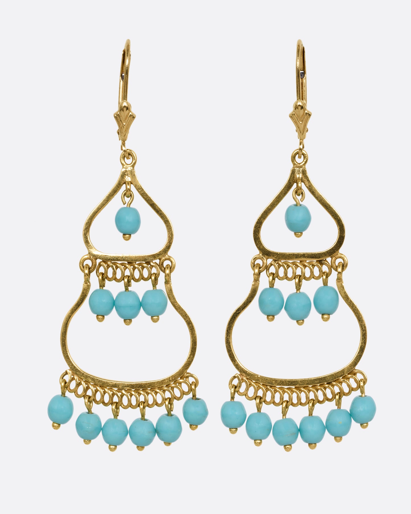 A pair of yellow gold drop chandelier earrings with turquoise beads, shown from the front.