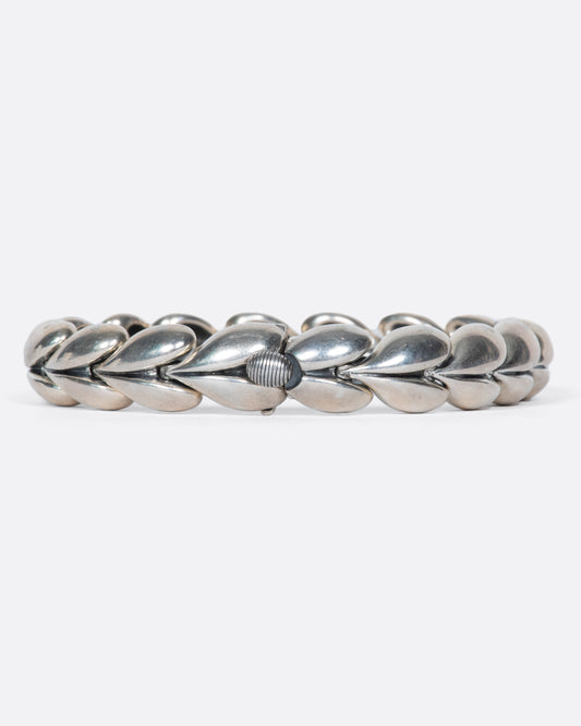 This vintage Thai sterling silver bracelet is made entirely of sweet, puffy hearts.