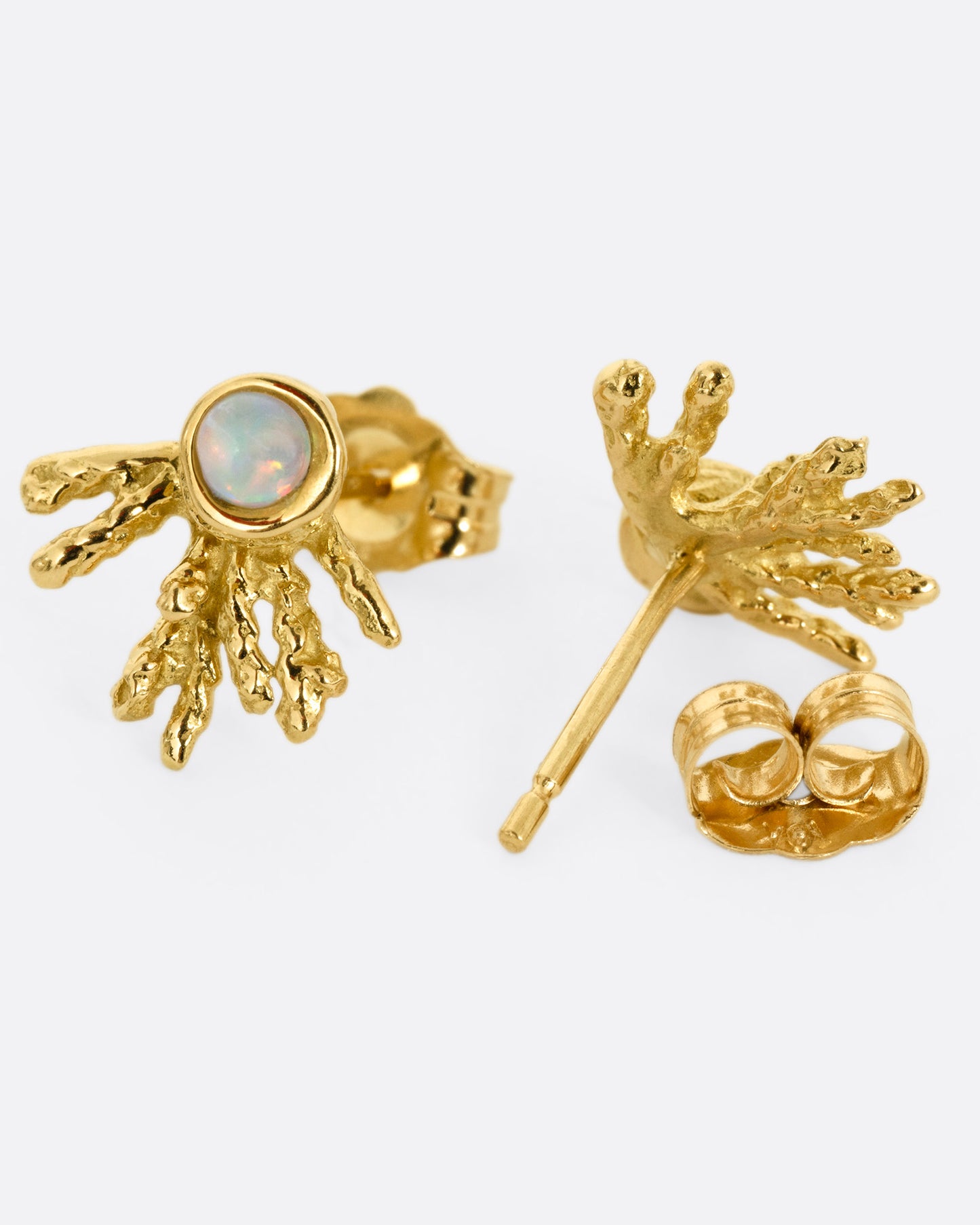 A pair of yellow gold stud earrings with tentacle-like tails and opals. One earring is shown from the front, the other from the back open.