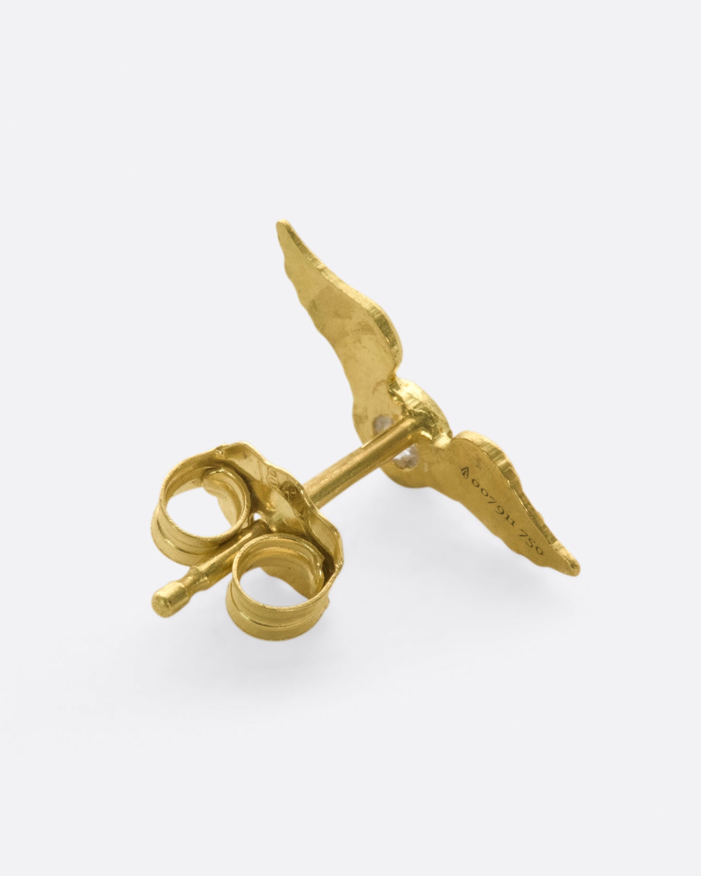 This little stud is inspired by the winged mountings and pavé wing pieces of late Victorian jewelry.