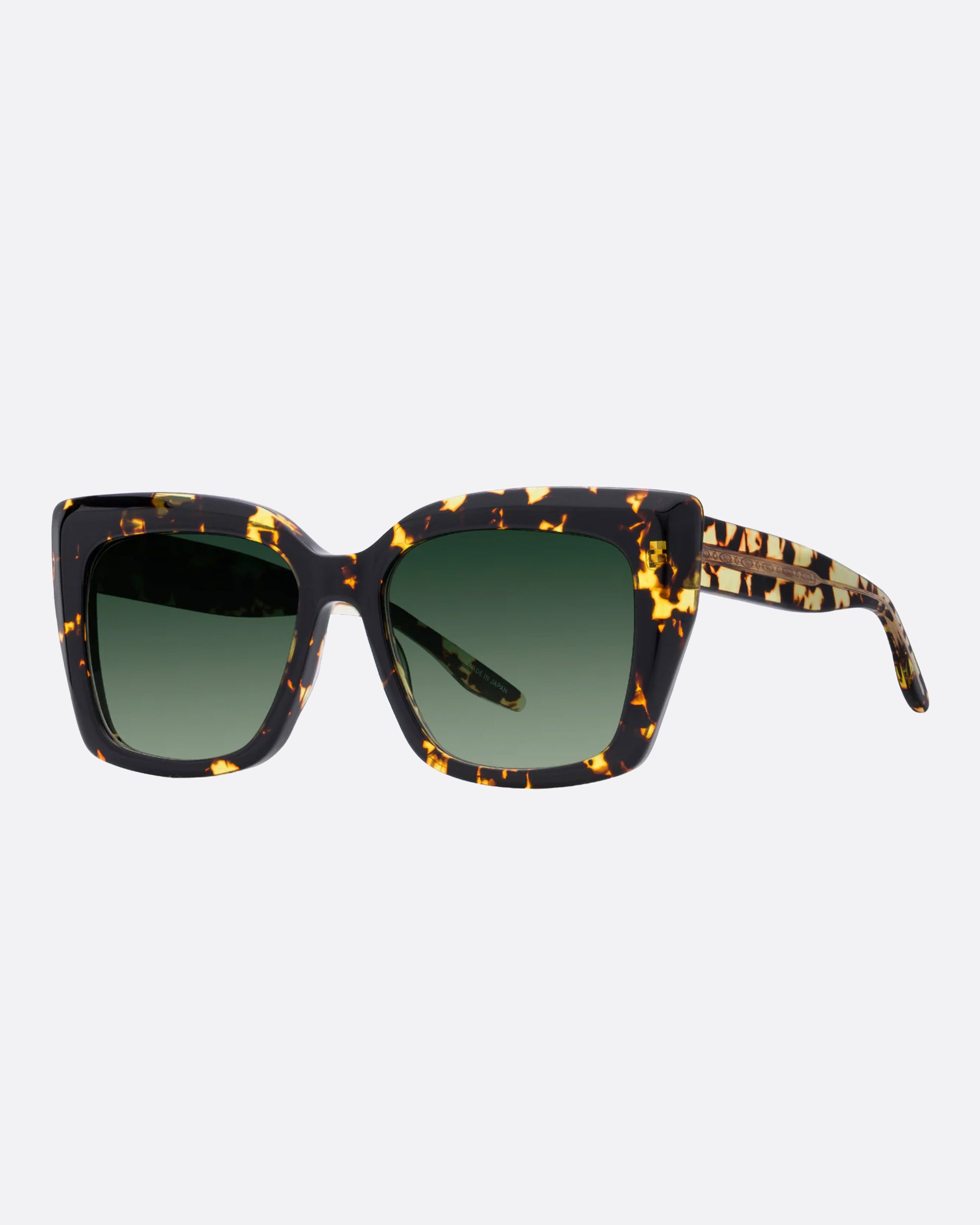 A bold, beveled acetate frame with a 24k gold plated titanium core in the most perfect tortoise with green gradient lenses.