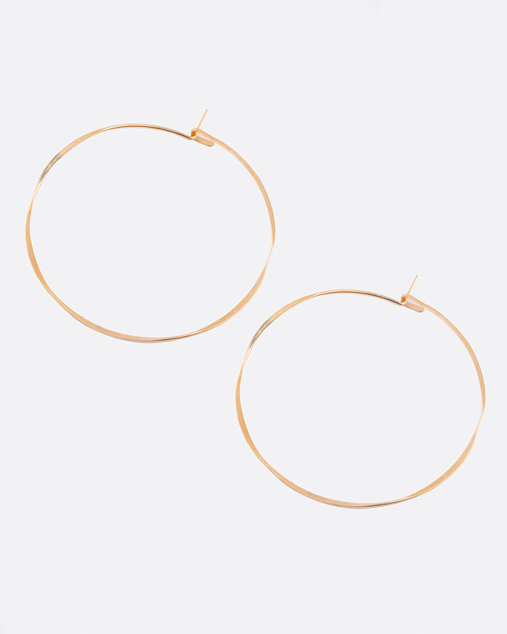 Fairmined gold, hand-hammered, large round hoop earrings that close upon themselves.