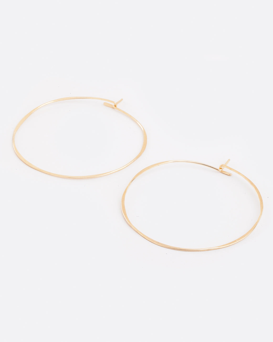 Fairmined gold, hand-hammered, large round hoop earrings that close upon themselves.