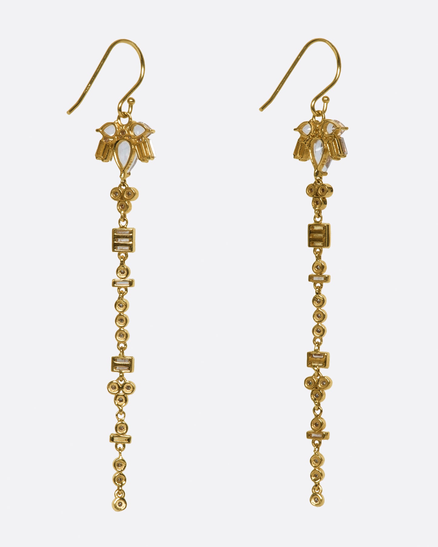 A pair of 14k gold drop earrings with a geometric variety of white topaz and diamonds.