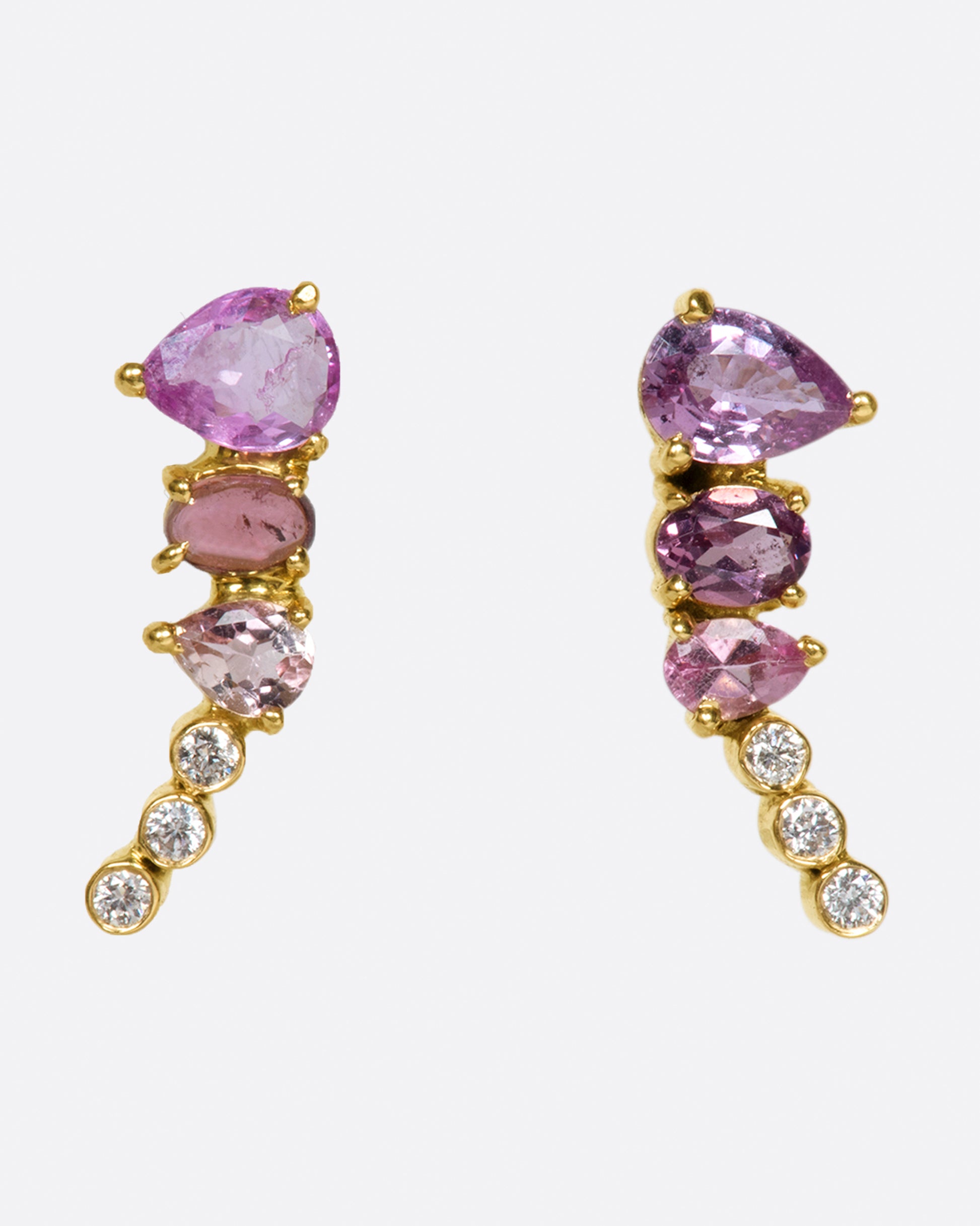 An exceptional pink and purple sapphire and tourmaline earring that elegantly tapers to a diamond tail. 