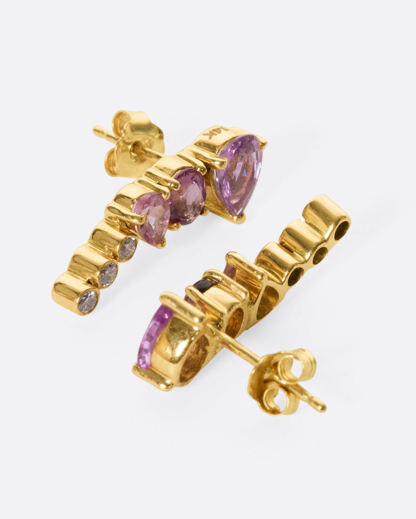 An exceptional pink and purple sapphire and tourmaline earring that elegantly tapers to a diamond tail. 