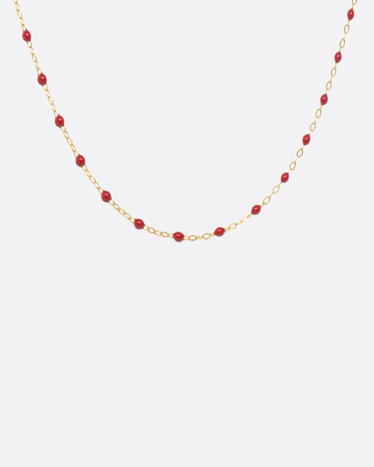 Thin 18k yellow gold chain necklace with resin beads, shown in a 16 inch length