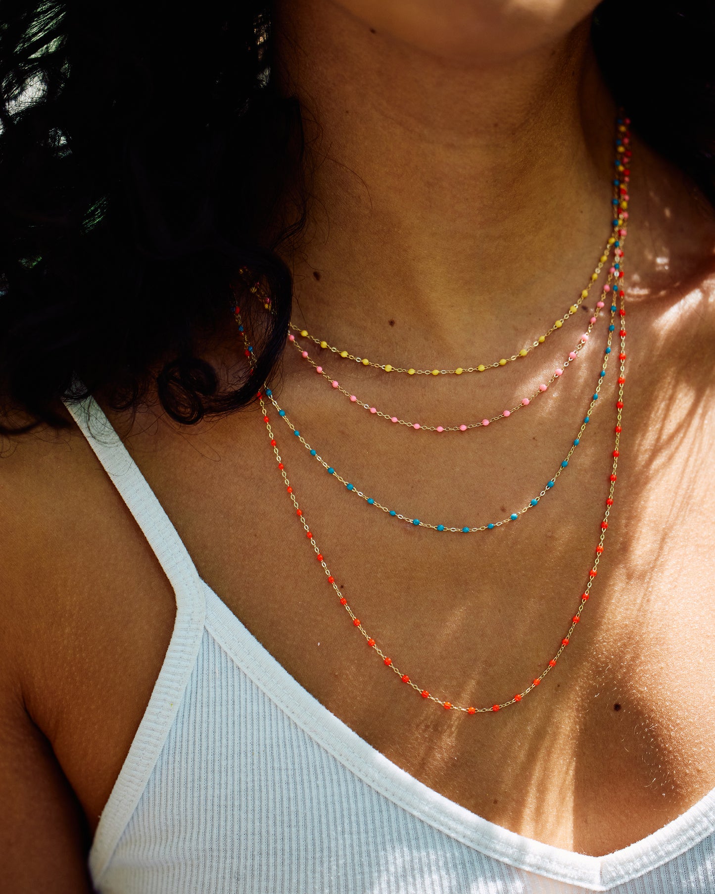 Thin 18k yellow gold chain necklace with resin beads. Each necklace is hand dipped in melted resin to create the beaded effect. 