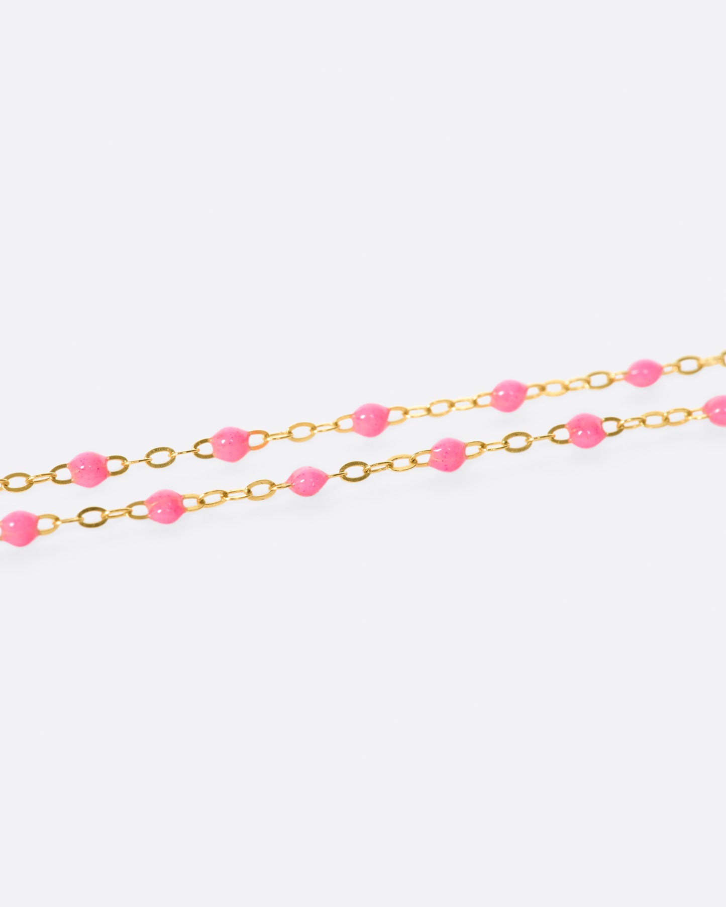 Thin 18k yellow gold chain necklace with resin beads. Each necklace is hand dipped in melted resin to create the beaded effect.