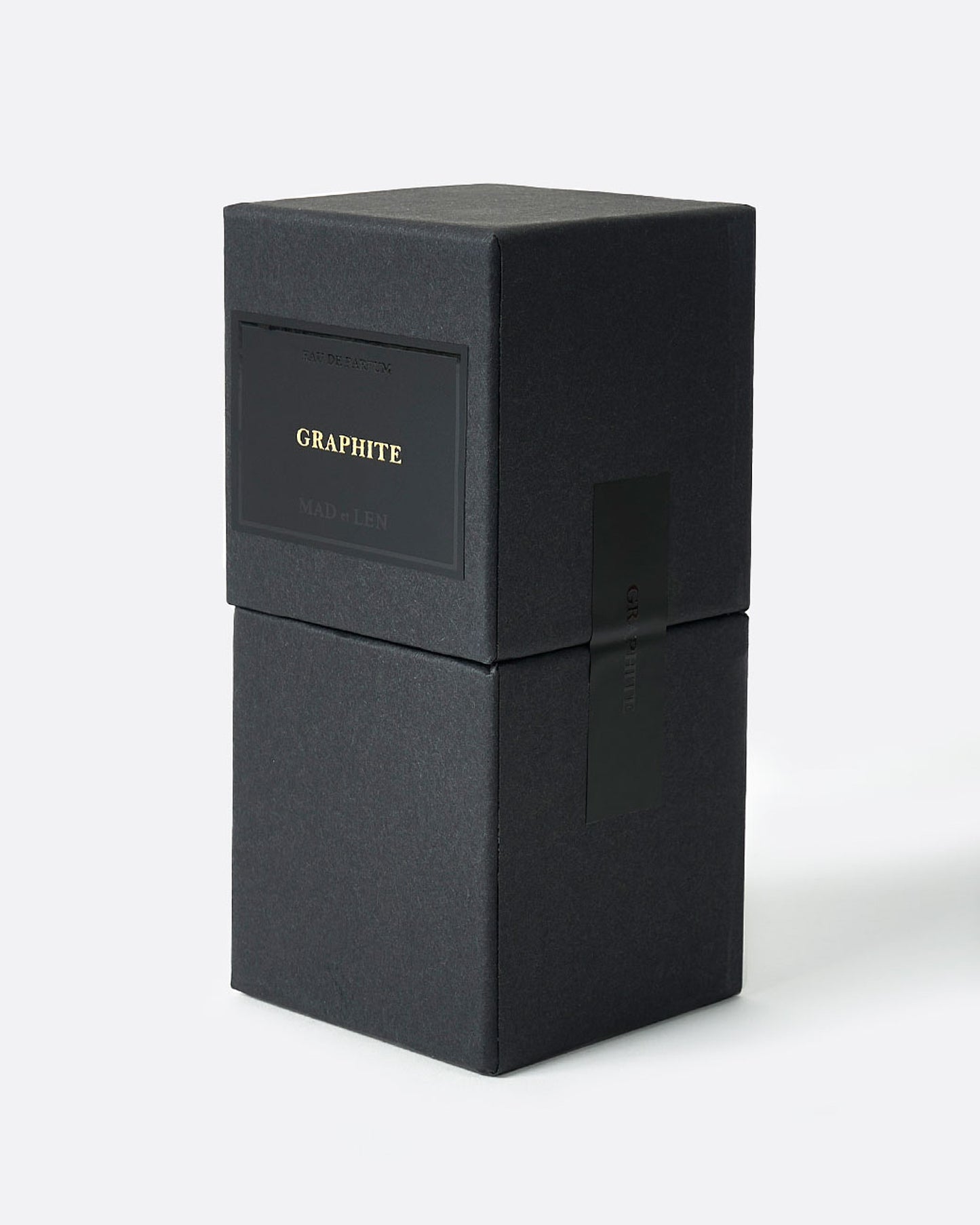 A black box with a black label and gold lettering that says GRAPHITE. Shown diagonally from the side.
