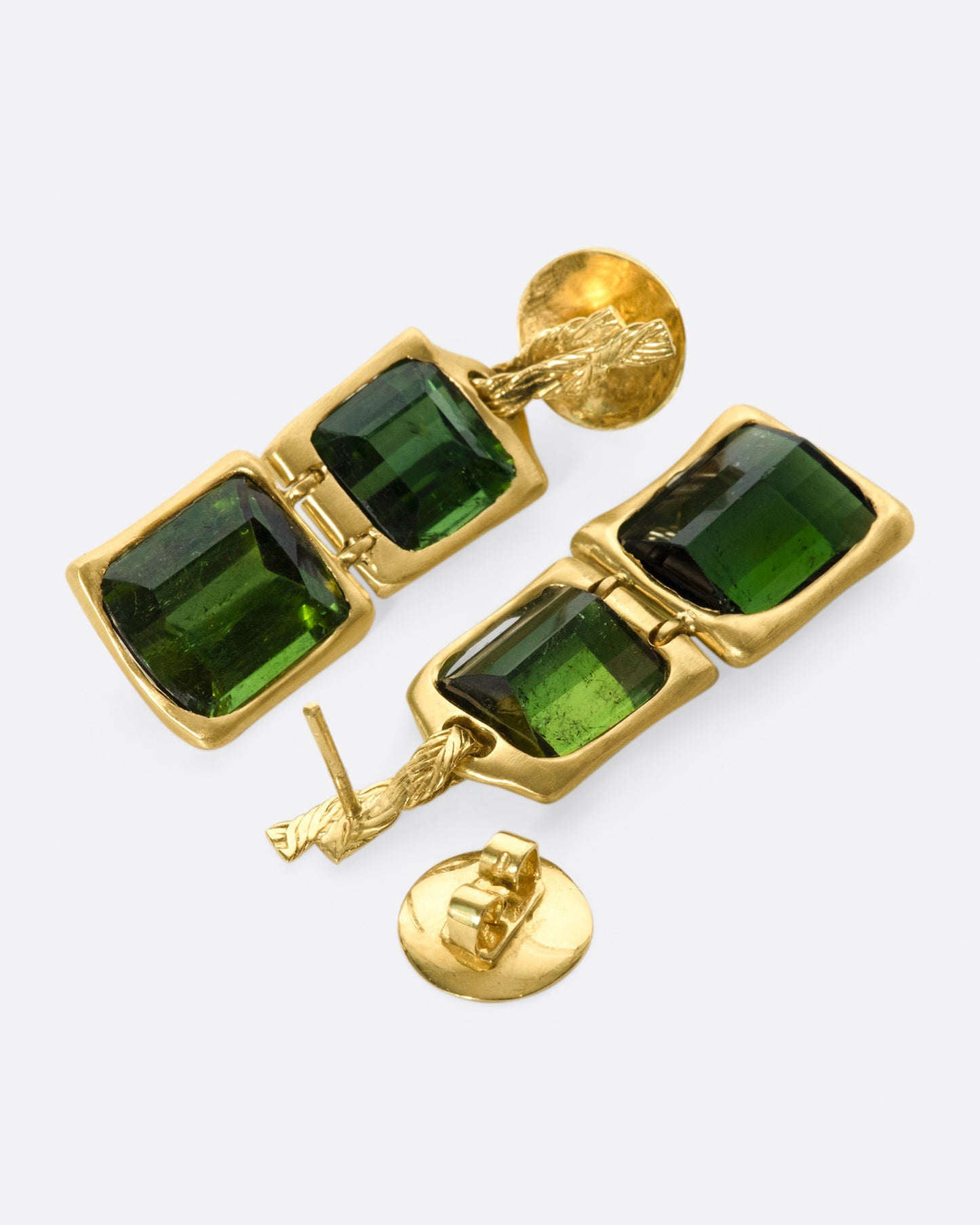 These deep green earrings are hinged between the two tourmalines, giving them some great movement and swing.