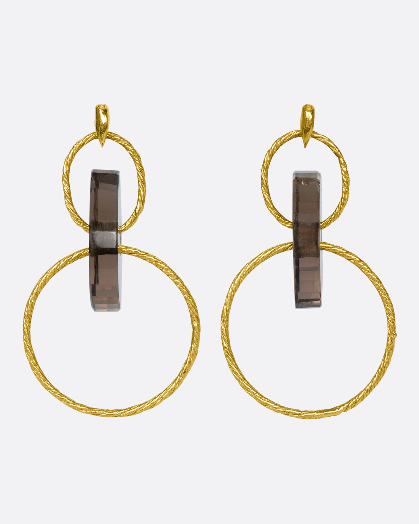 A pair of yellow gold stud earrings with two circular drops that are connected by smokey quartz beads.
