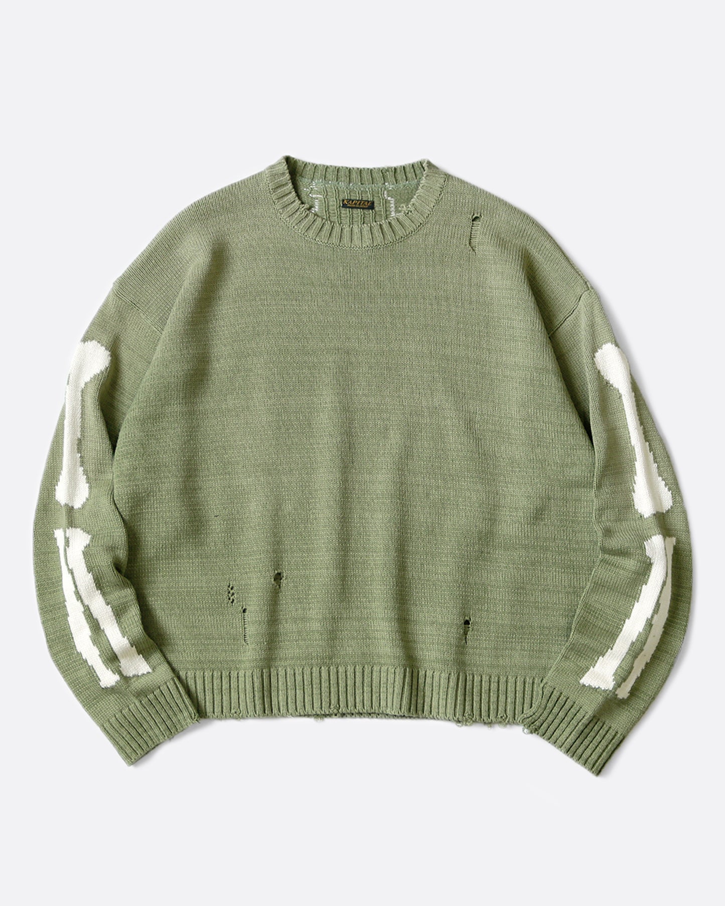 A distressed, sage green crewneck sweater with Kapital's beloved bone design on the back and sleeves.