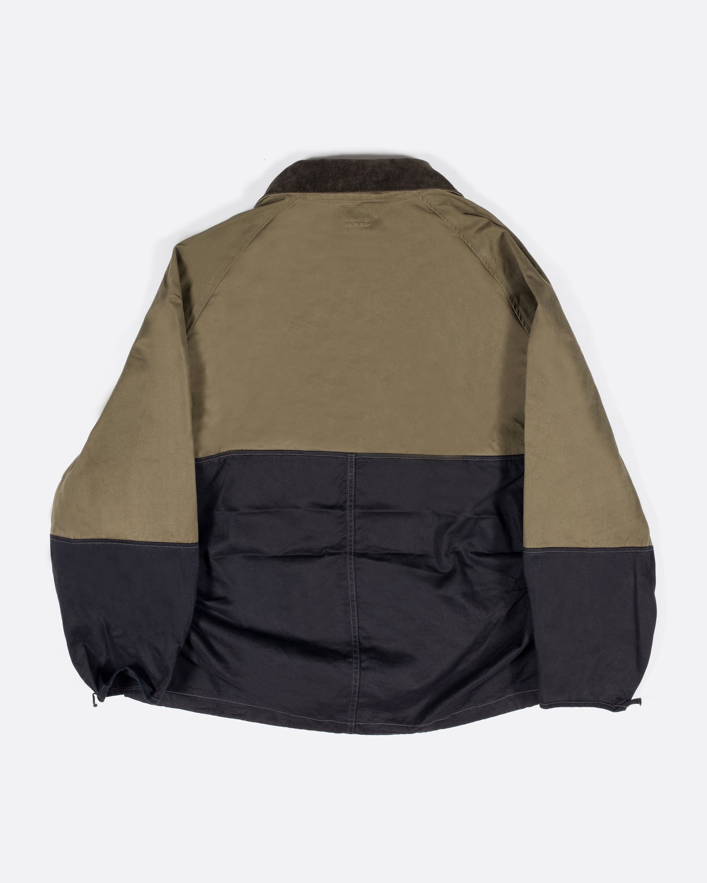 One of Kapital's beloved anoraks, made from two colors of cotton chino material with six mini pockets around the neck and a zip pocket with a flap on the front.