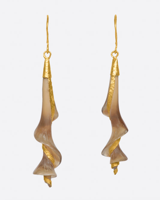 A pair of 22k yellow gold earrings with swirled brown horn drops.