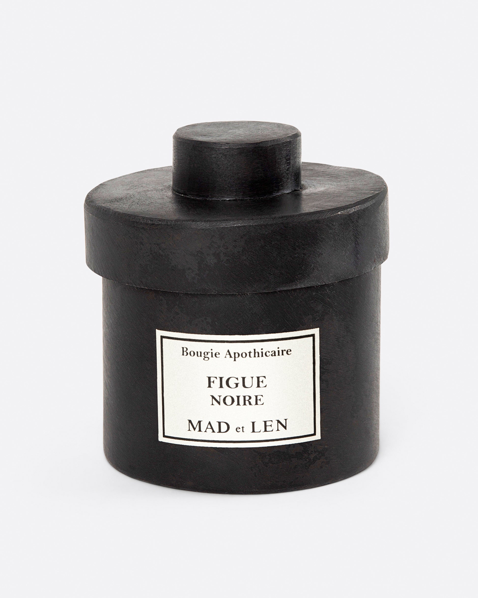 A Mad et Len Figue Noire candle, shown from the front.