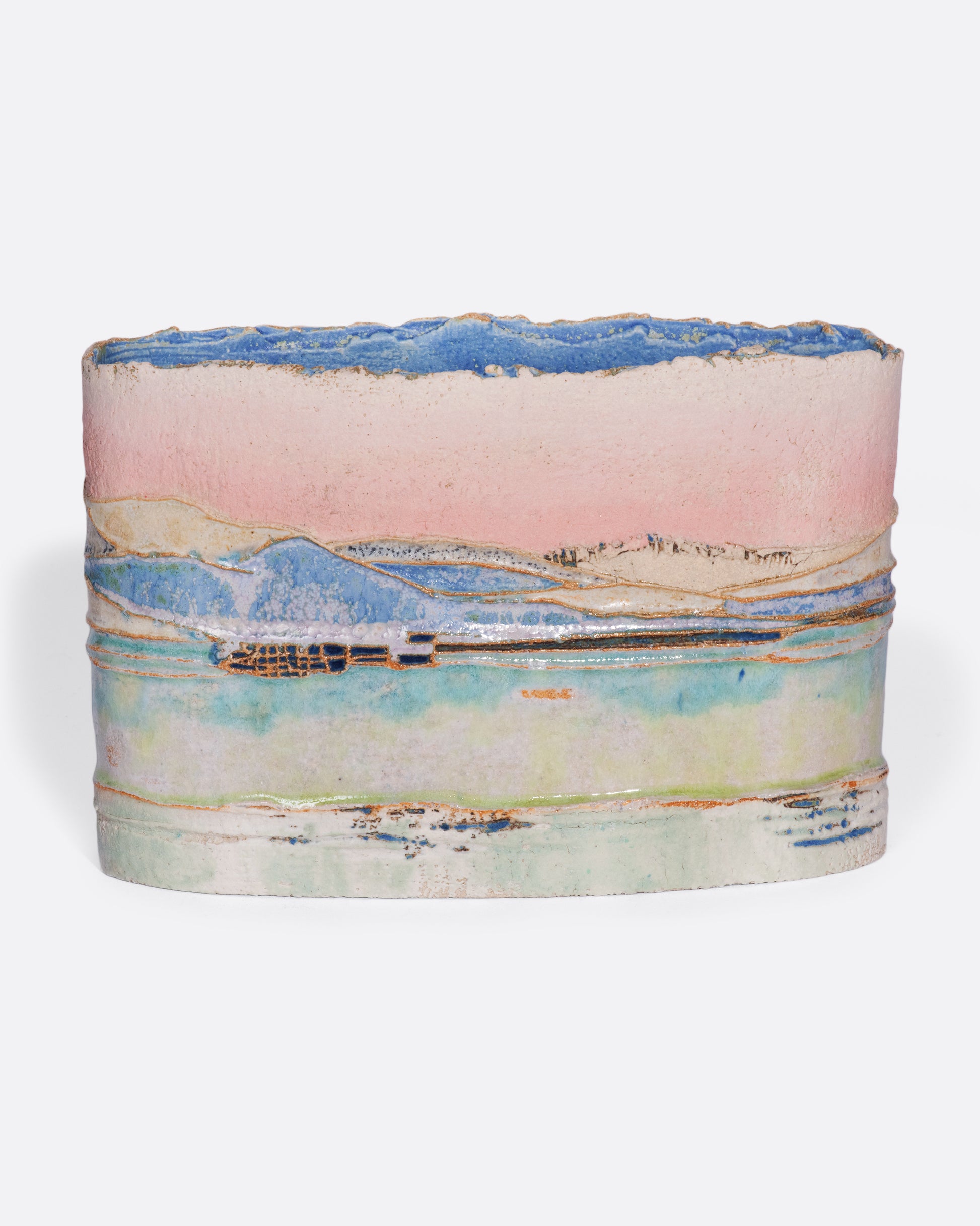 This ceramic vessel is meticulously handmade with many layers of glaze atop stoneware clay, creating a rich, varied texture. The landscape feels like you're gazing across a lake, watching clouds pass and reflect on its surface