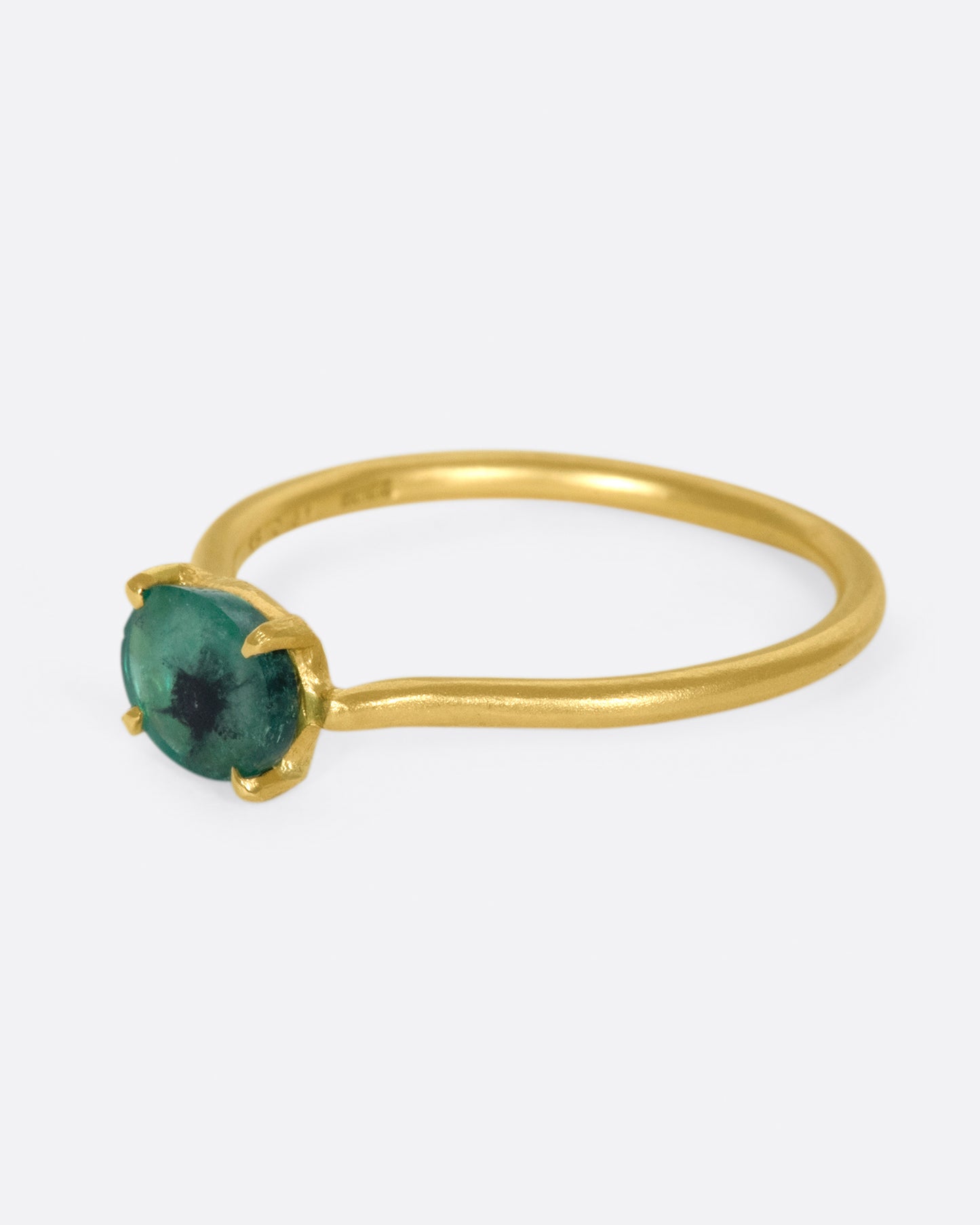 A simple solitaire ring with a glorious oval emerald.