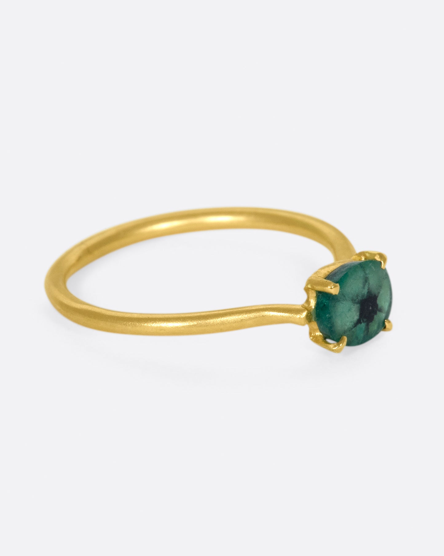 A simple solitaire ring with a glorious oval emerald.