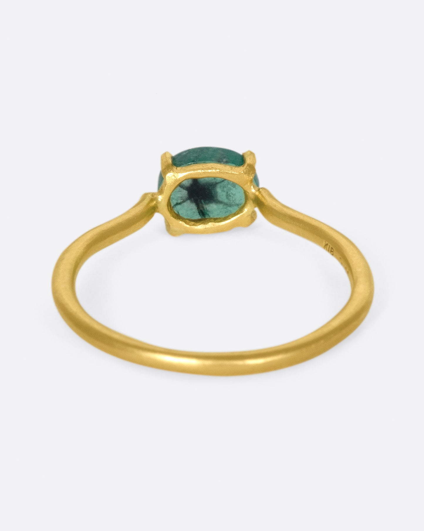 A simple solitaire ring with a glorious oval emerald.