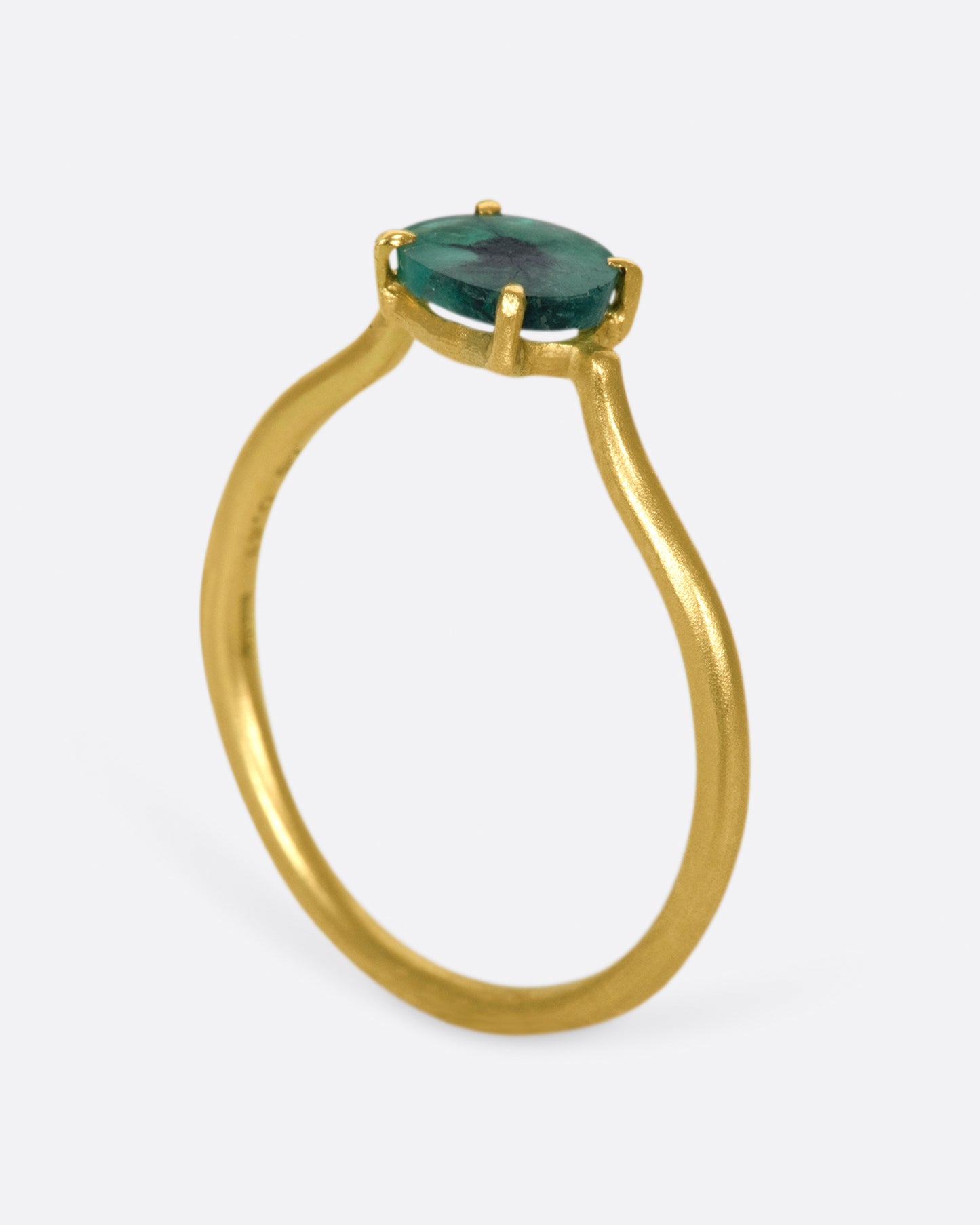 A simple solitaire ring with a glorious oval emerald.